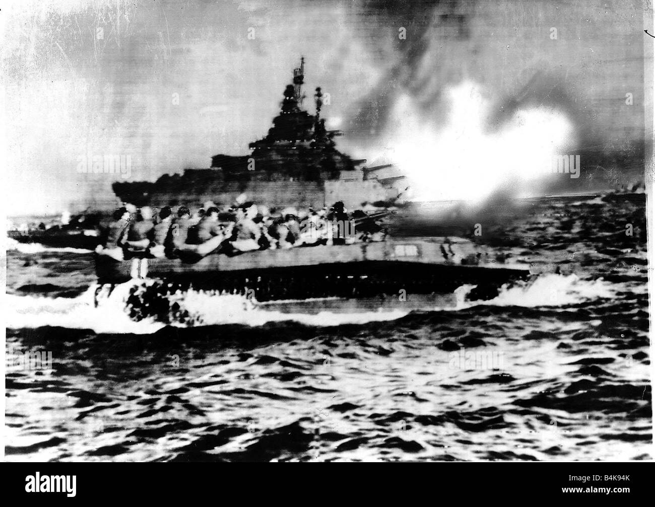 Us Battleship Covers Landing Craft Heading For Okinawa Beach During Ww2 Jun 1945 Stock Photo Alamy