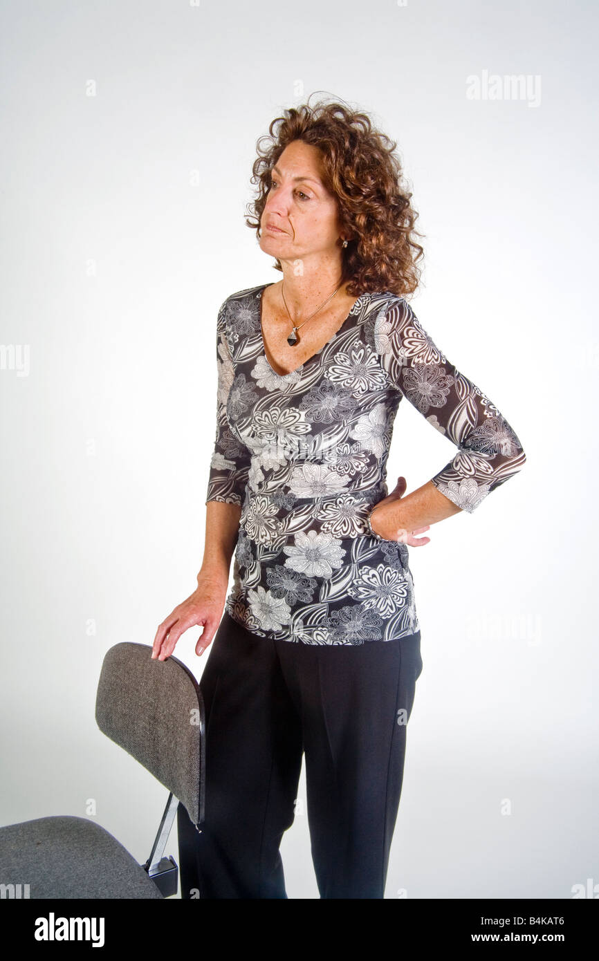 The gesture of tapping or drumming her fingers indicates impatience in