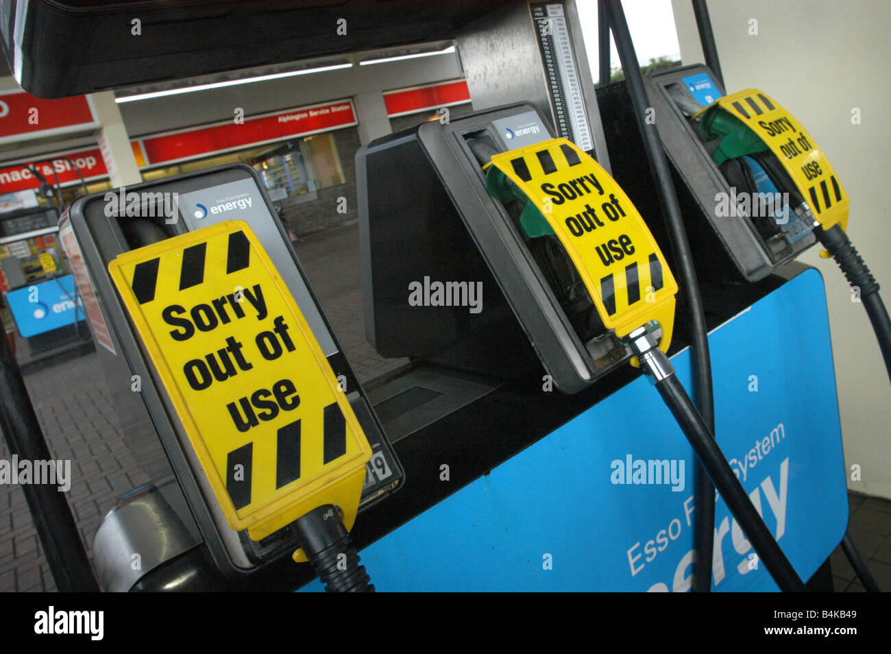 Sorry out of use signs at petrol pumps Stock Photo