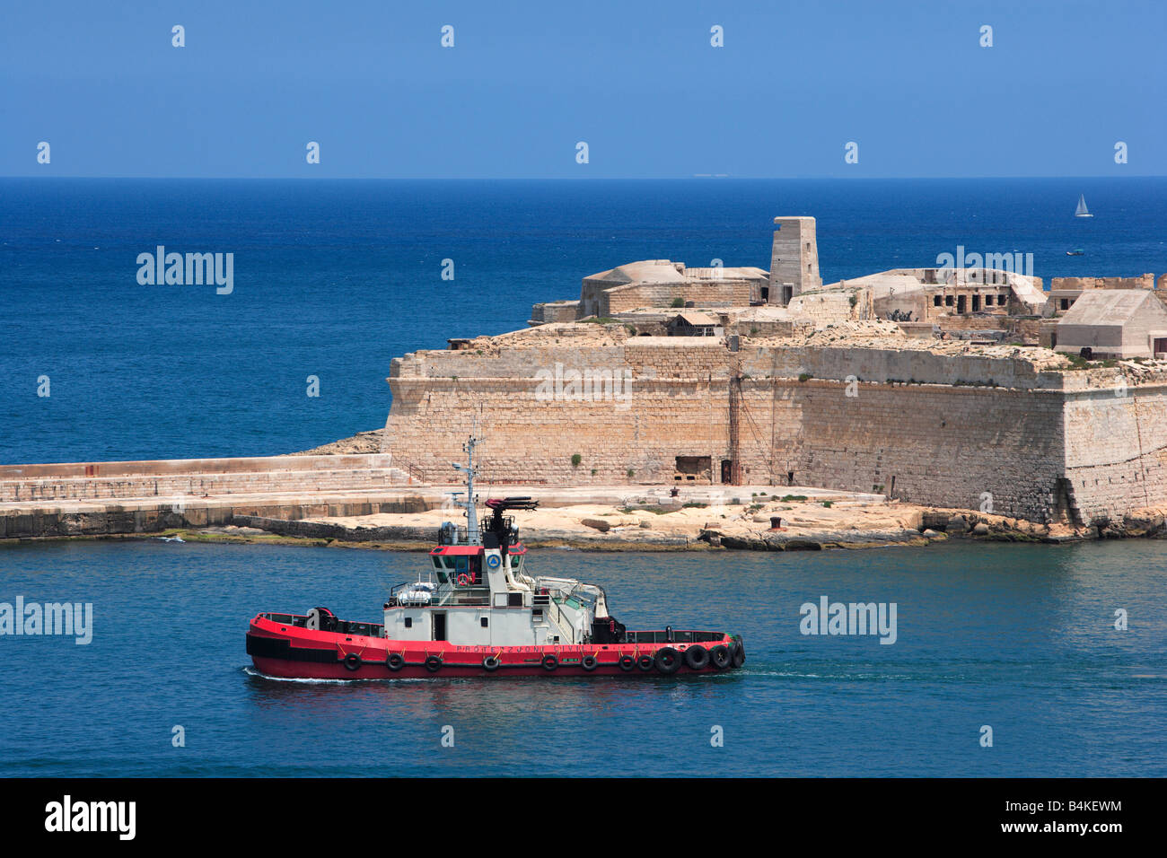 Grand Harbour and Fort Ricasoli Malta with tug Stock Photo
