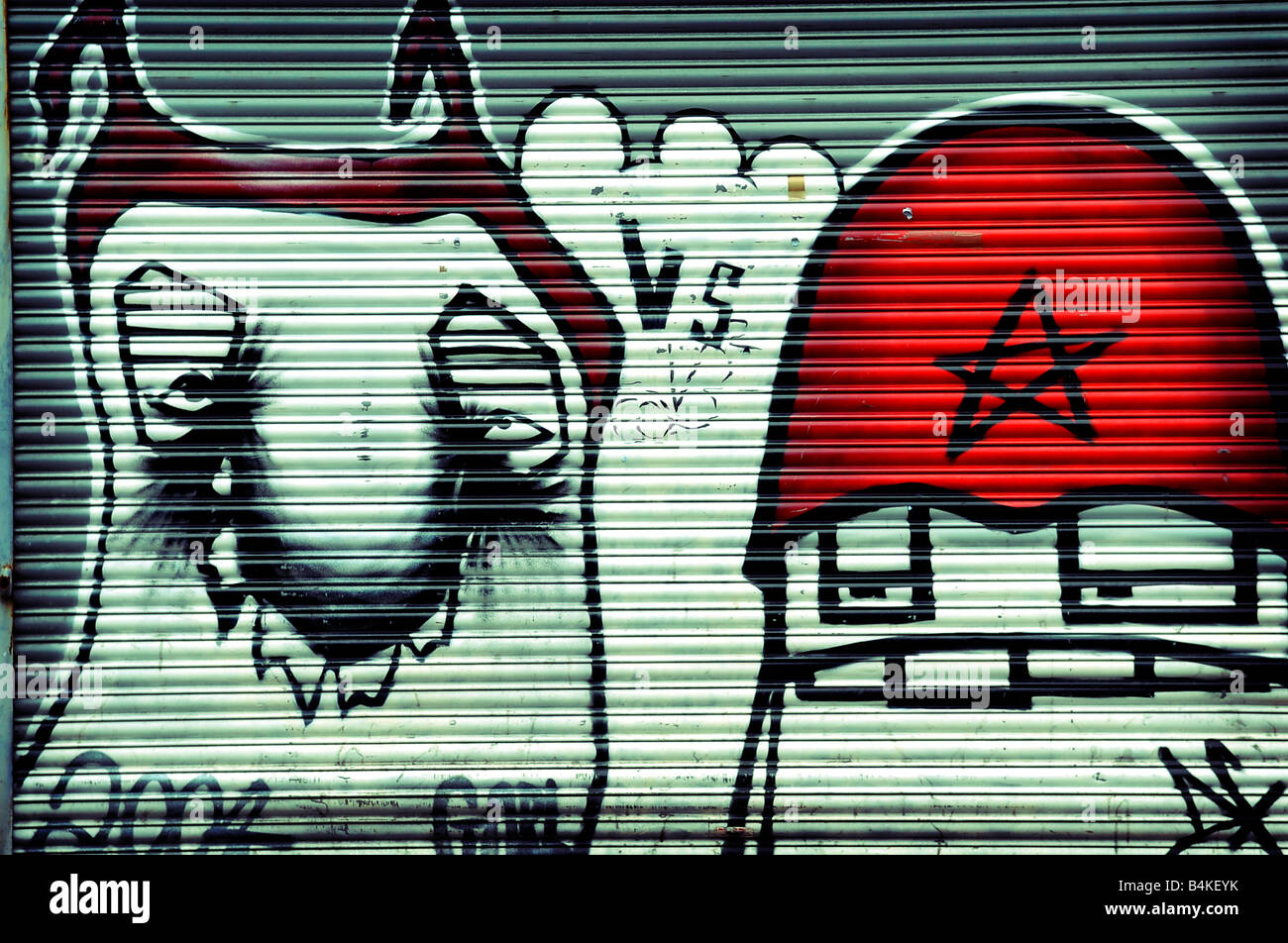 graffiti art spraypaint thomas street northern quarter manchester england uk city shutters cartoon characters red white Stock Photo