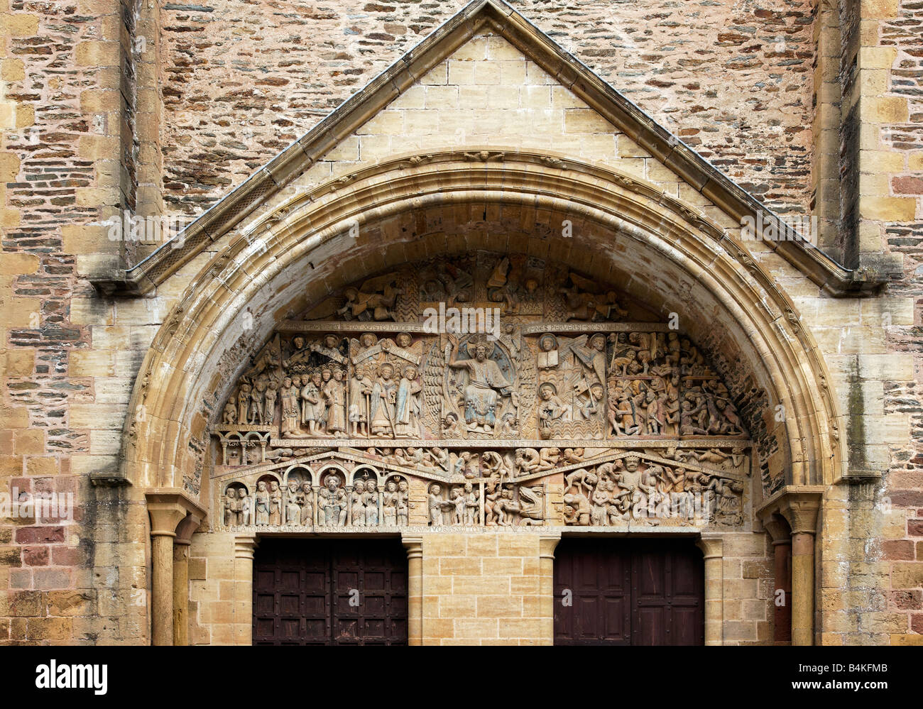 Ornate carvings at the entrance to Saint Foy Abbey Church, Conques Stock Photo