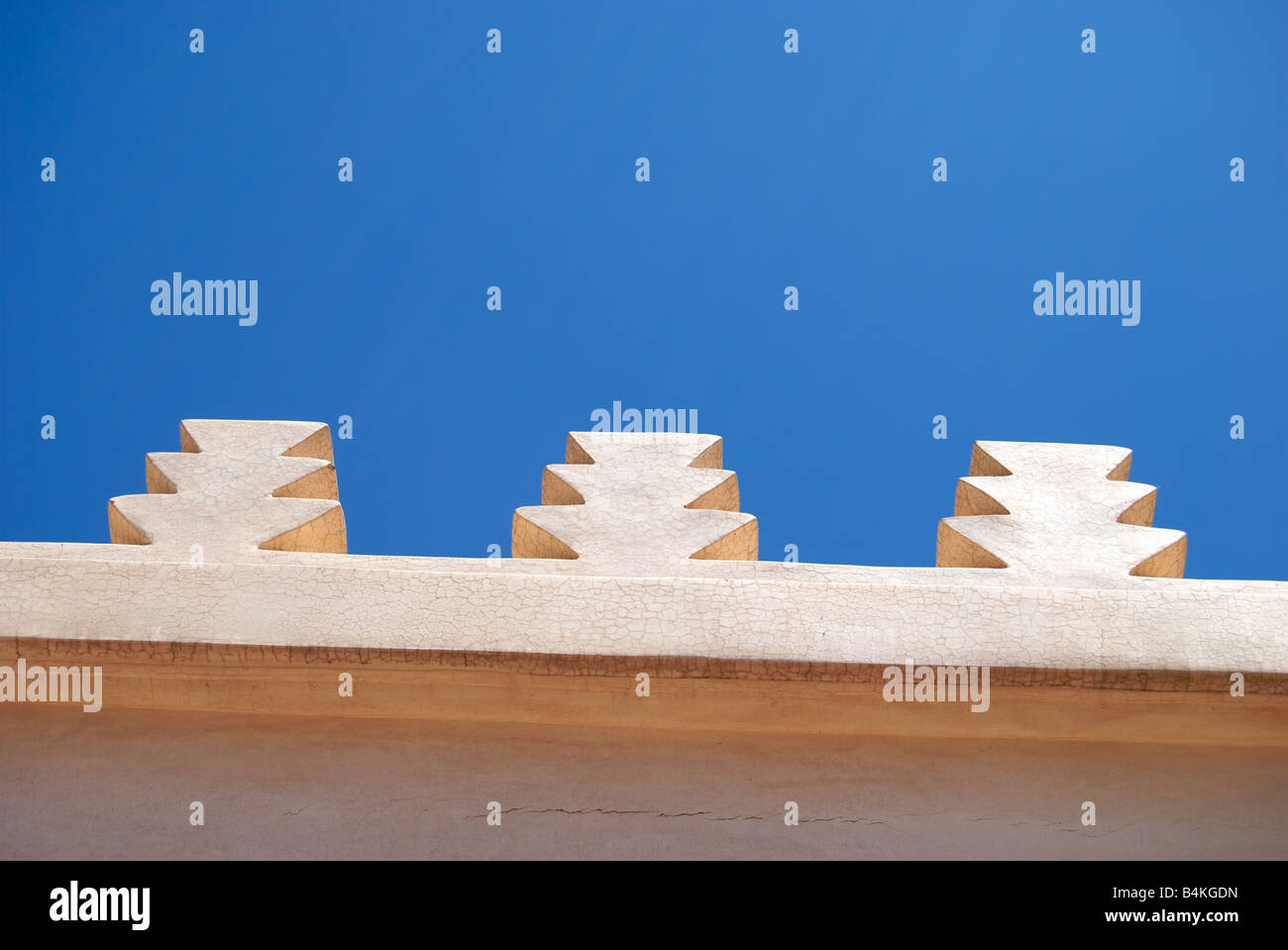 Decorative architecture feature of a building against a perfectly blue sky in Marrakech, Morocco. Stock Photo