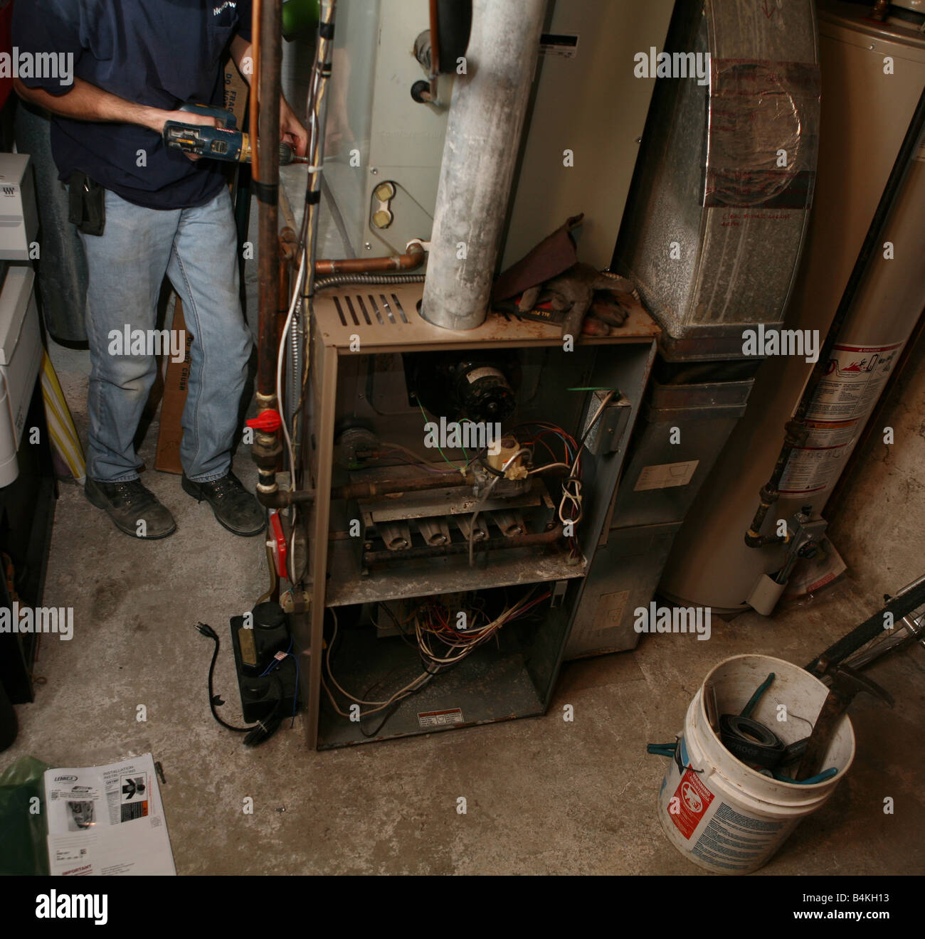 Installation of new highefficiency gas furnace Stock Photo Alamy