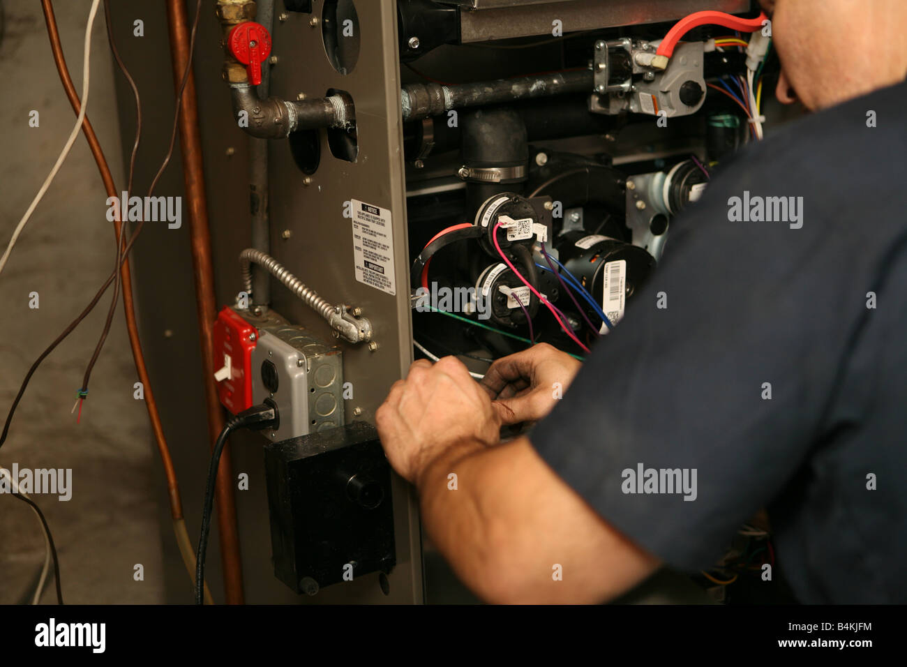 Installation of new highefficiency gas furnace Stock Photo Alamy