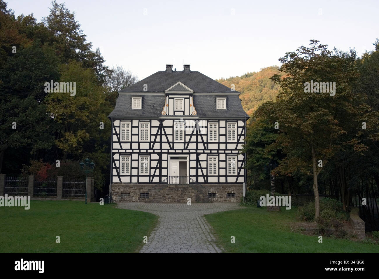 halftimbered mansion with slated roof with an old lane in the foreground Stock Photo