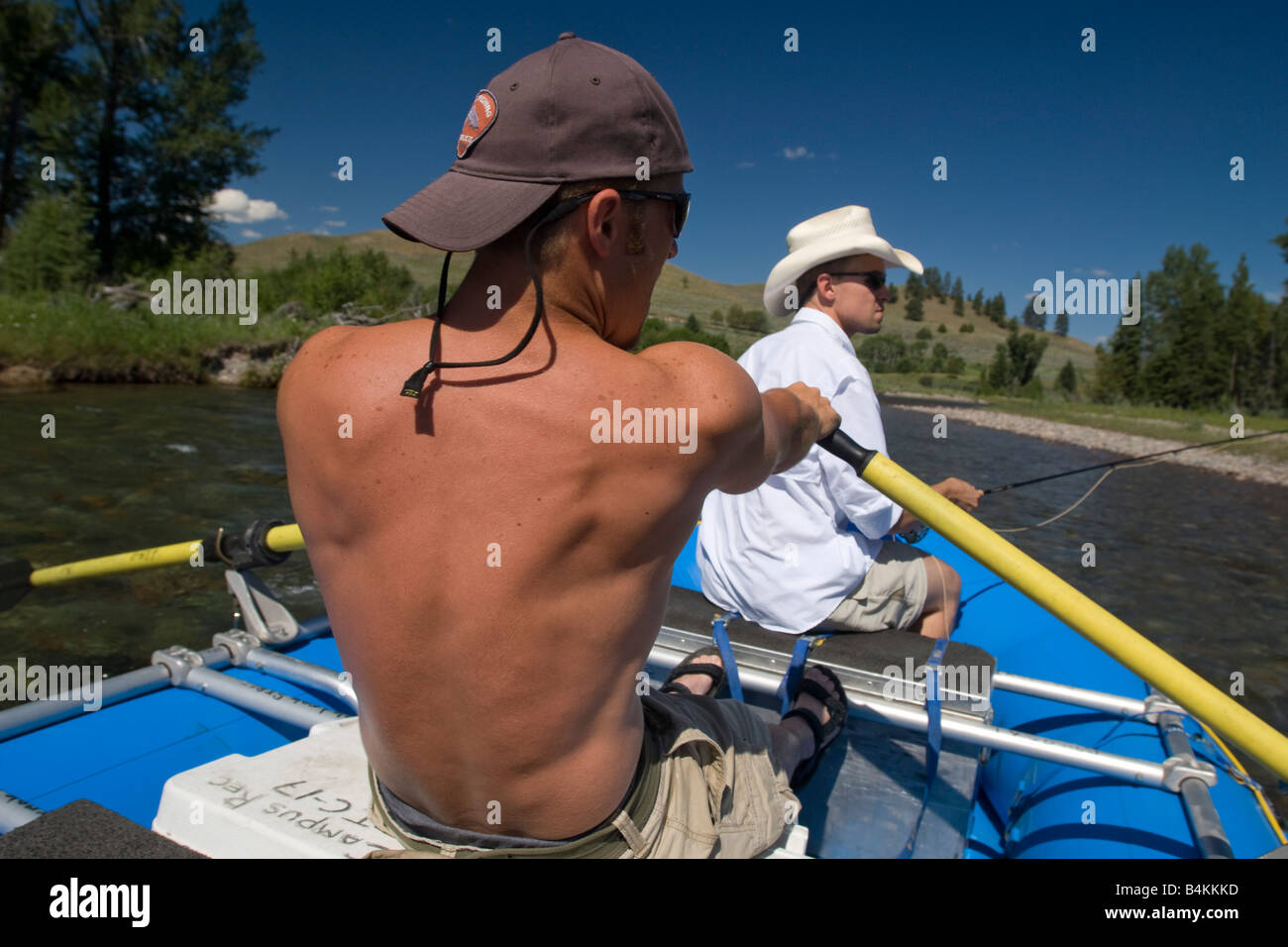 Anglers use an inflatable raft to fly fish the Blackfoot River near Missoula Montana Stock Photo