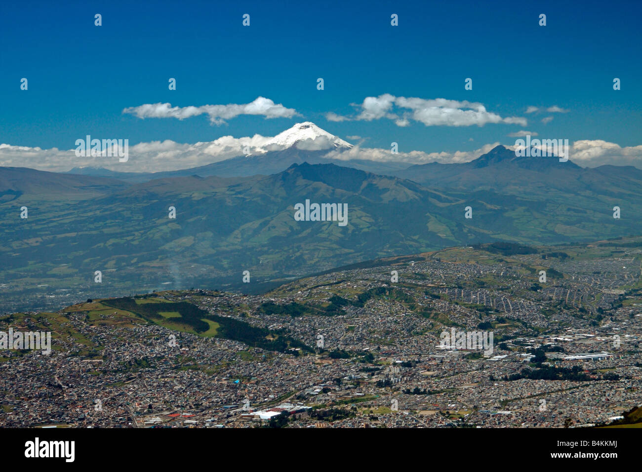 View of Quito and Cotopaxi volcano, from summit of Pichincha volcano, Quito, Ecuador. Stock Photo