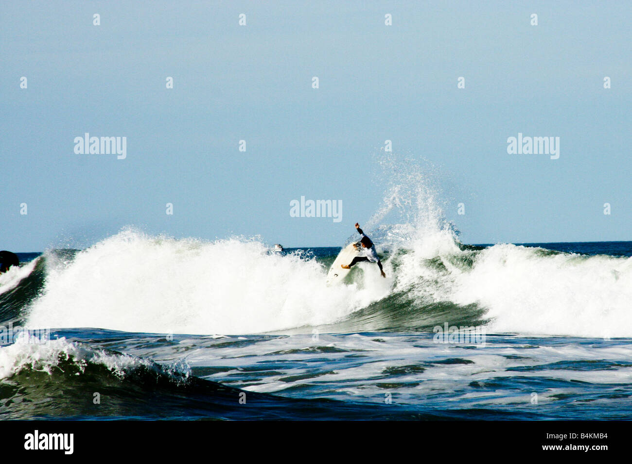 Surfer catching a wave Stock Photo Alamy