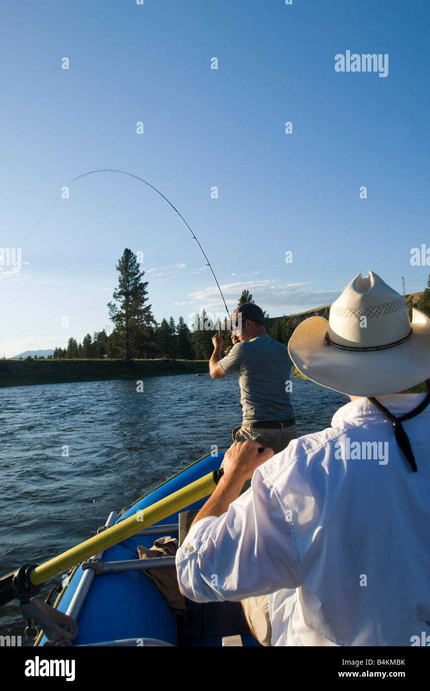 Anglers Raft Anglers use an inflatable raft to fly fish the Blackfoot River near ...