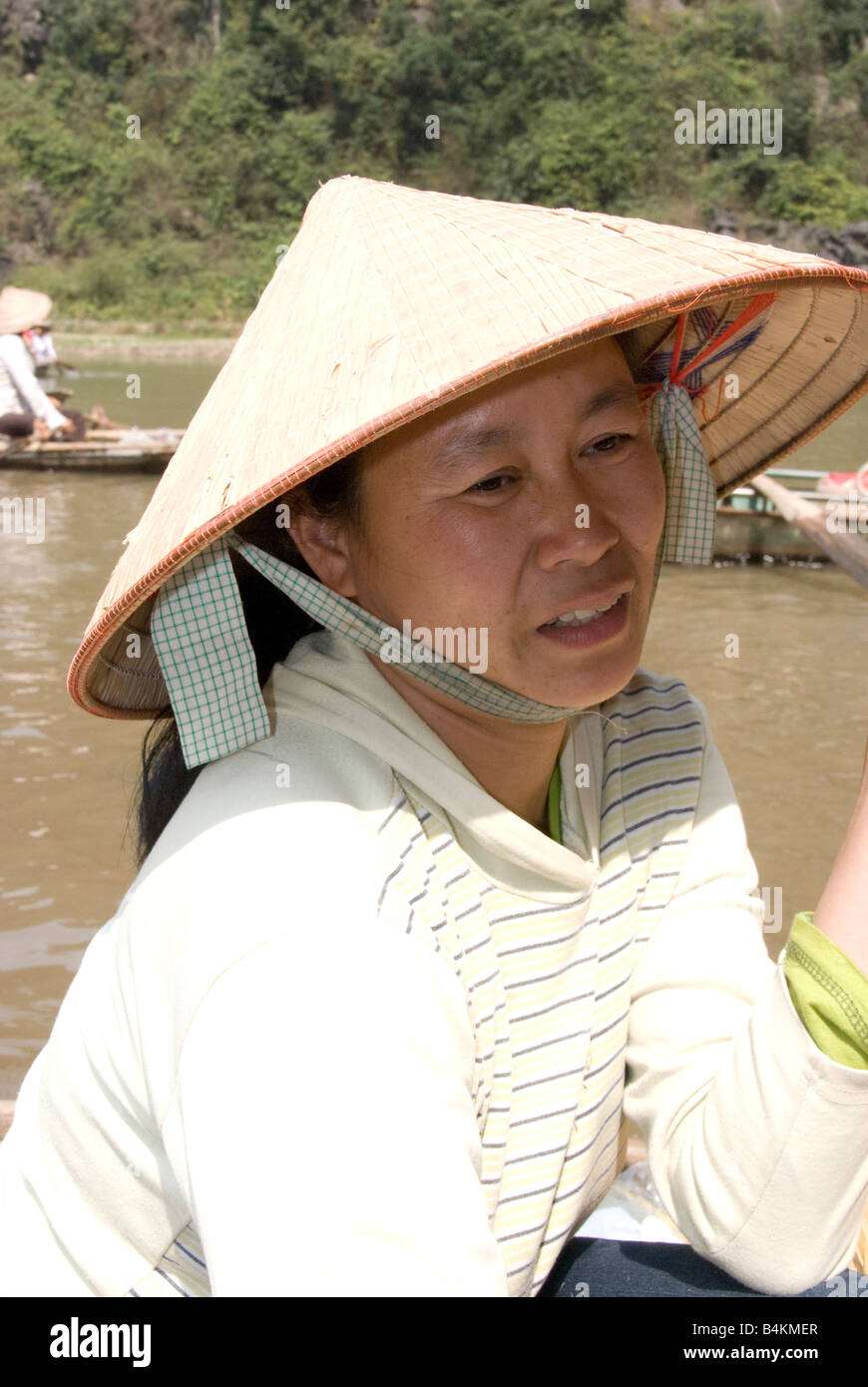 A vendor of fruit and drinks on the Ngo Dong River, Tam Coc, Vietnam Stock Photo