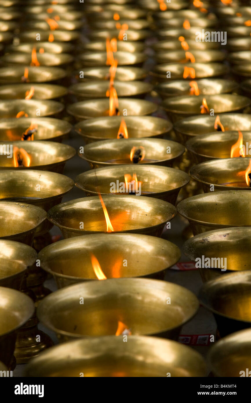 Brass cups are used as oil burners in a Chinese temple, Leshan, China Stock Photo