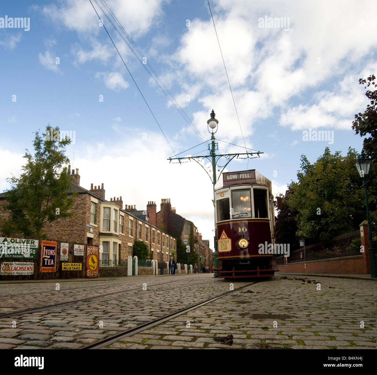 Victorian street scene with a tram car approaching from the right of the frame Stock Photo