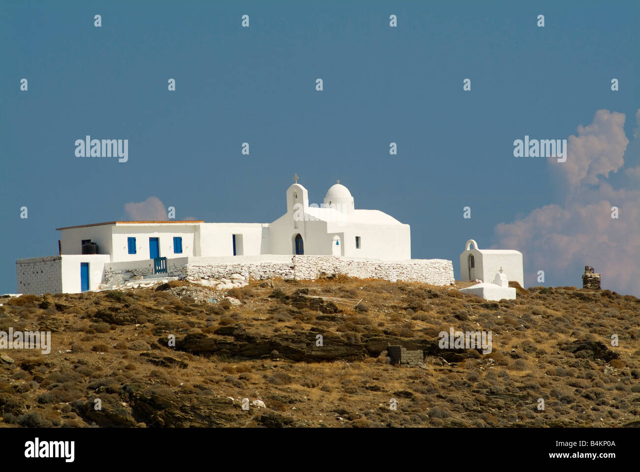 The beautiful White Fishermens Church Overlooking Lousa Bay Isle of Kithnos Cyclades Islands Aegean Sea Greece Stock Photo