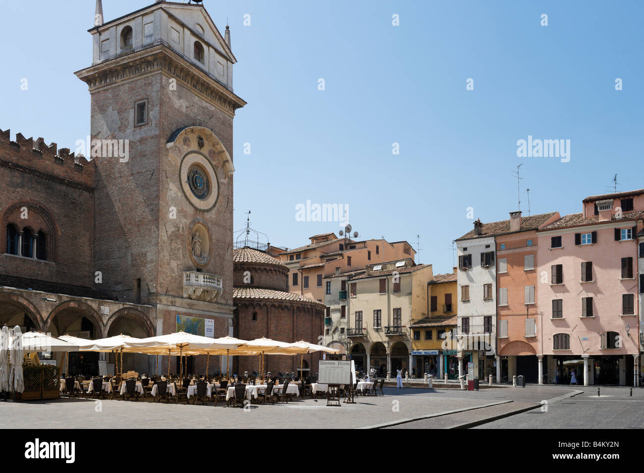 Restaurant outside the Palazzo della Ragione with the Rotonda church to the right, Piazza dell Erbe, Mantua, Lombardy, Italy Stock Photo