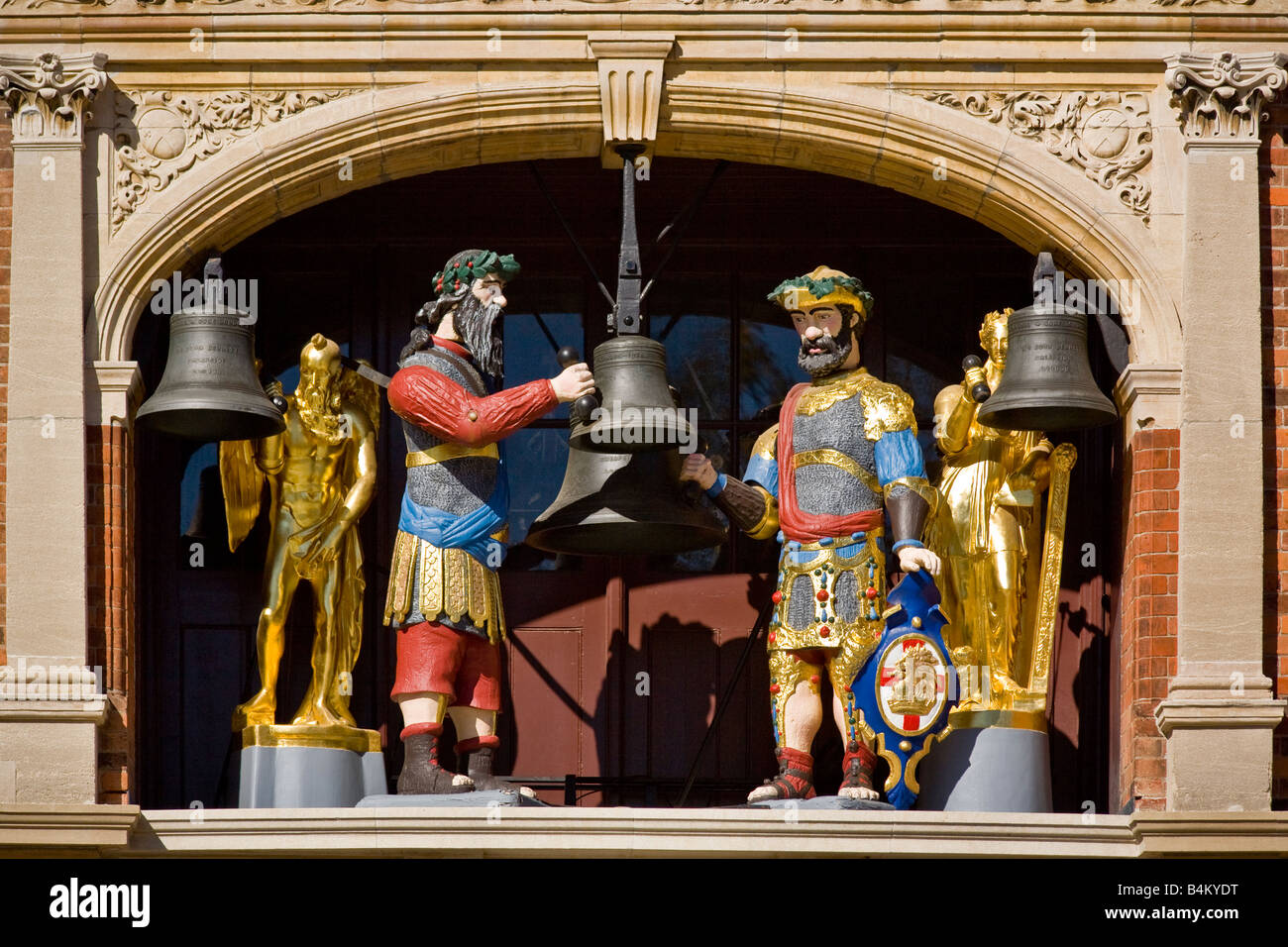 Symbolizing Gog and Magog the legendary protectors of Britain these mechanical figures toll the chimes of an outdoor clock Stock Photo