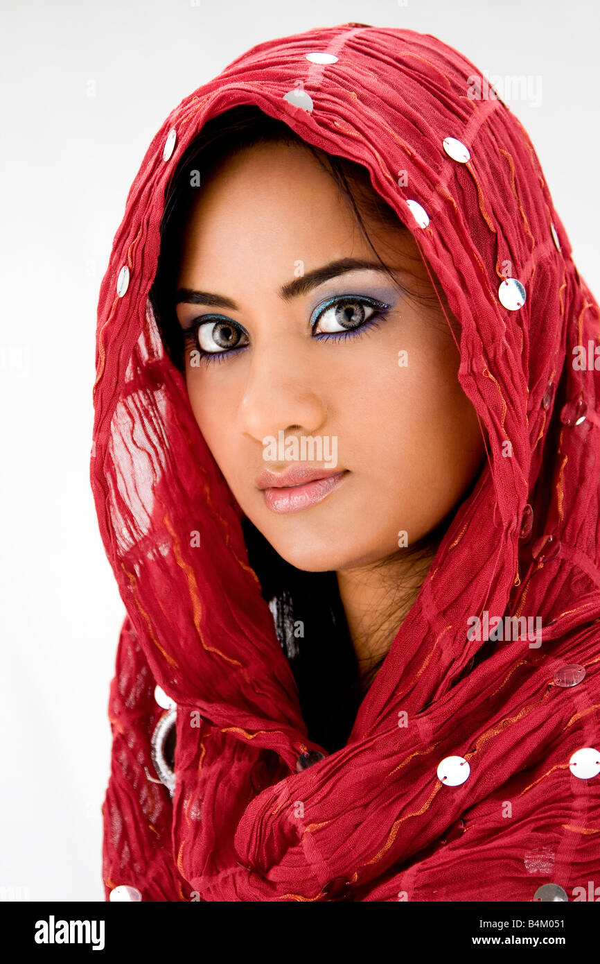 Beautiful woman with red head scarf isolated Stock Photo