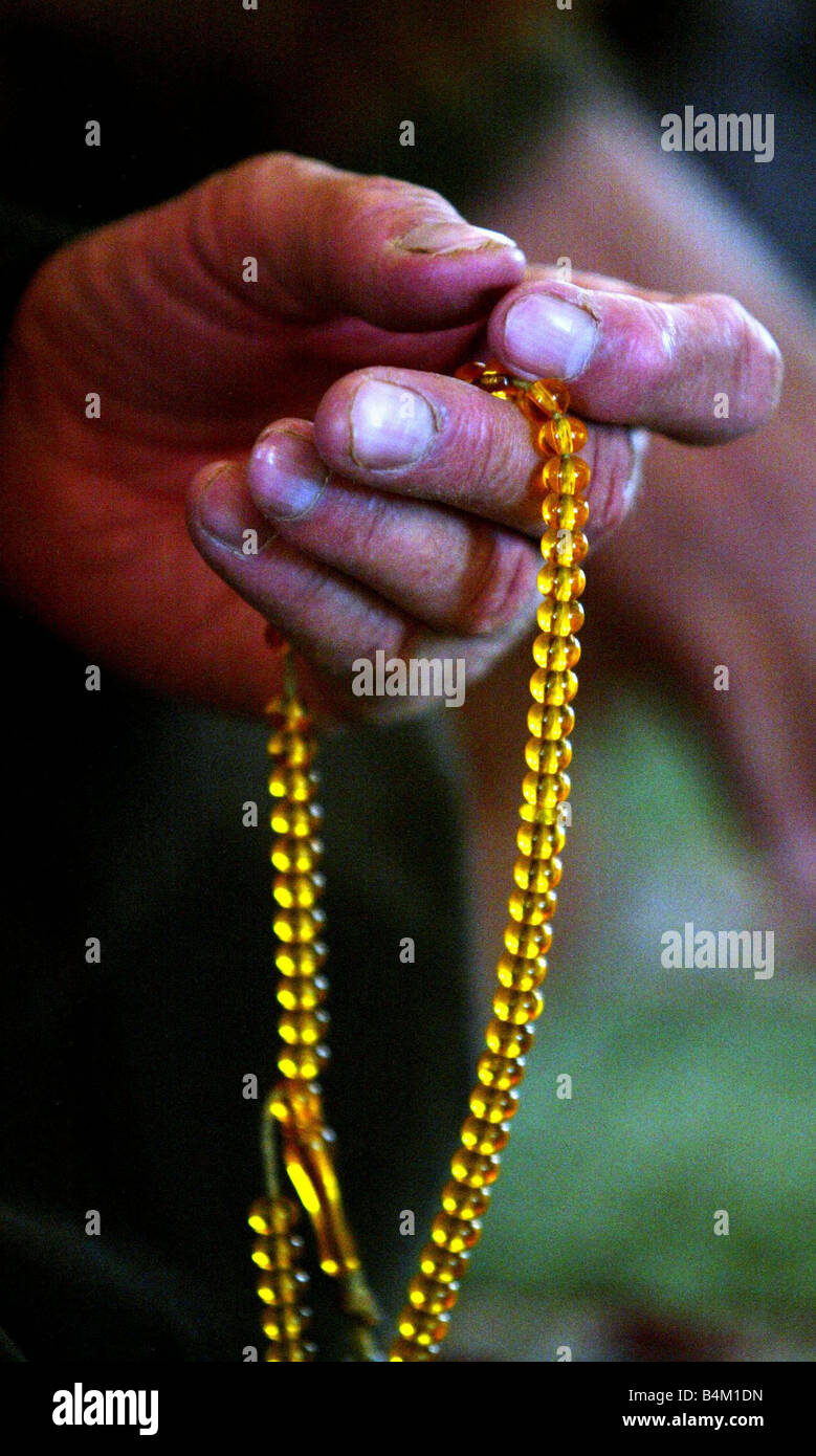 Iraq War March 2003 Prayers with worry beads in Mother Of All Battles Mosque in Baghdad prior to the coalition invasion of Iraq Stock Photo