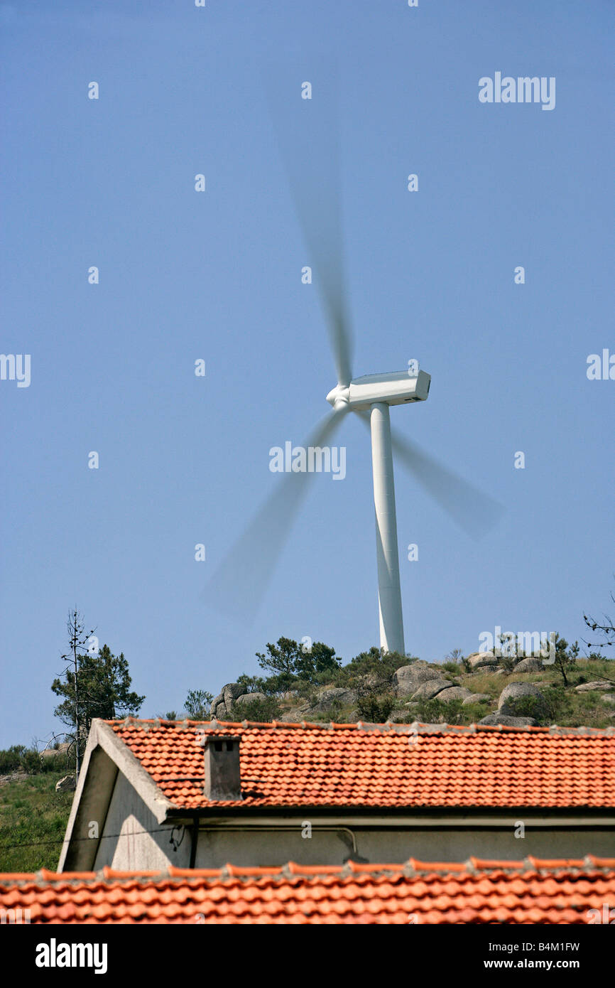 A large wind turbine near homes. Stock Photo