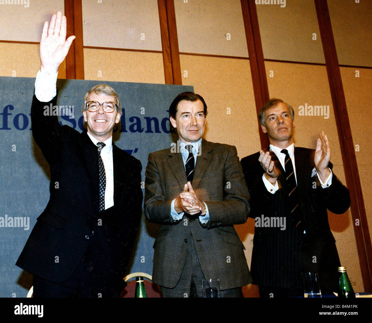 John Major Prime Minister in Moat House Hotel Glasgow waving and being applauded by Ian Lang and Michael Hirst Circa 1992 Stock Photo