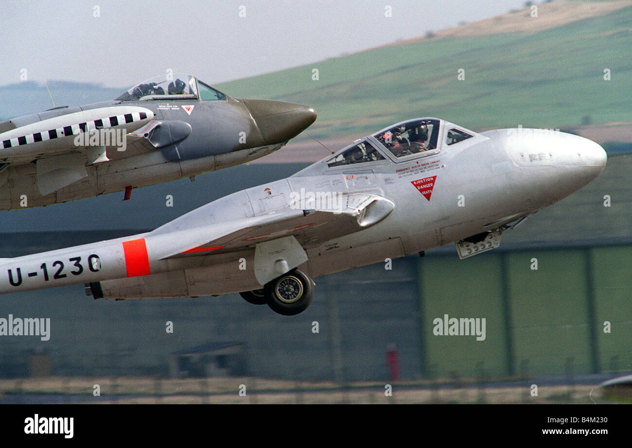 Aircraft deHavilland Vampire and Venom August 1993 taking off in formation at the Wroughton Airshow Stock Photo