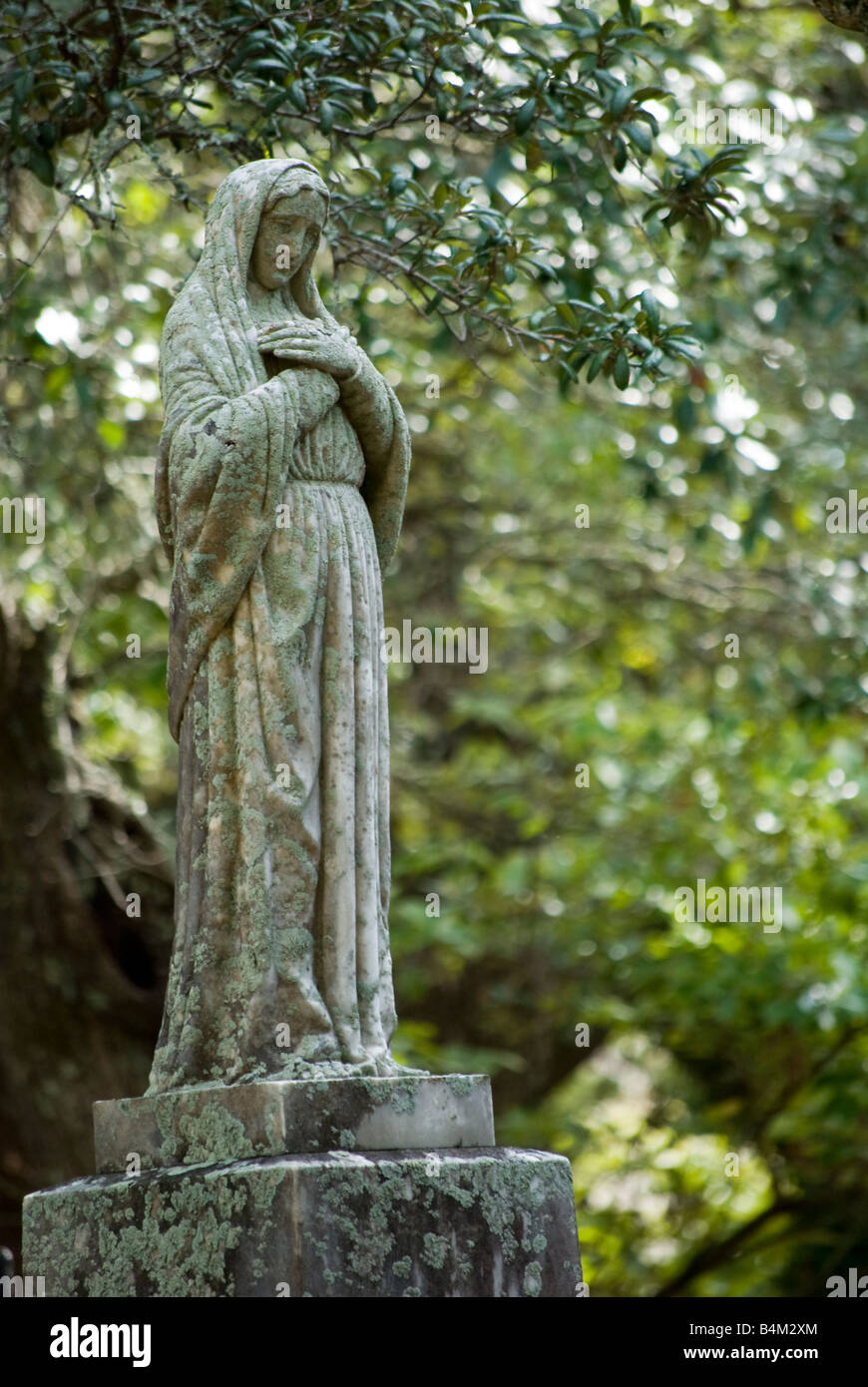 Statue of the virgin Mary on an old cemetery burial ground in downtown