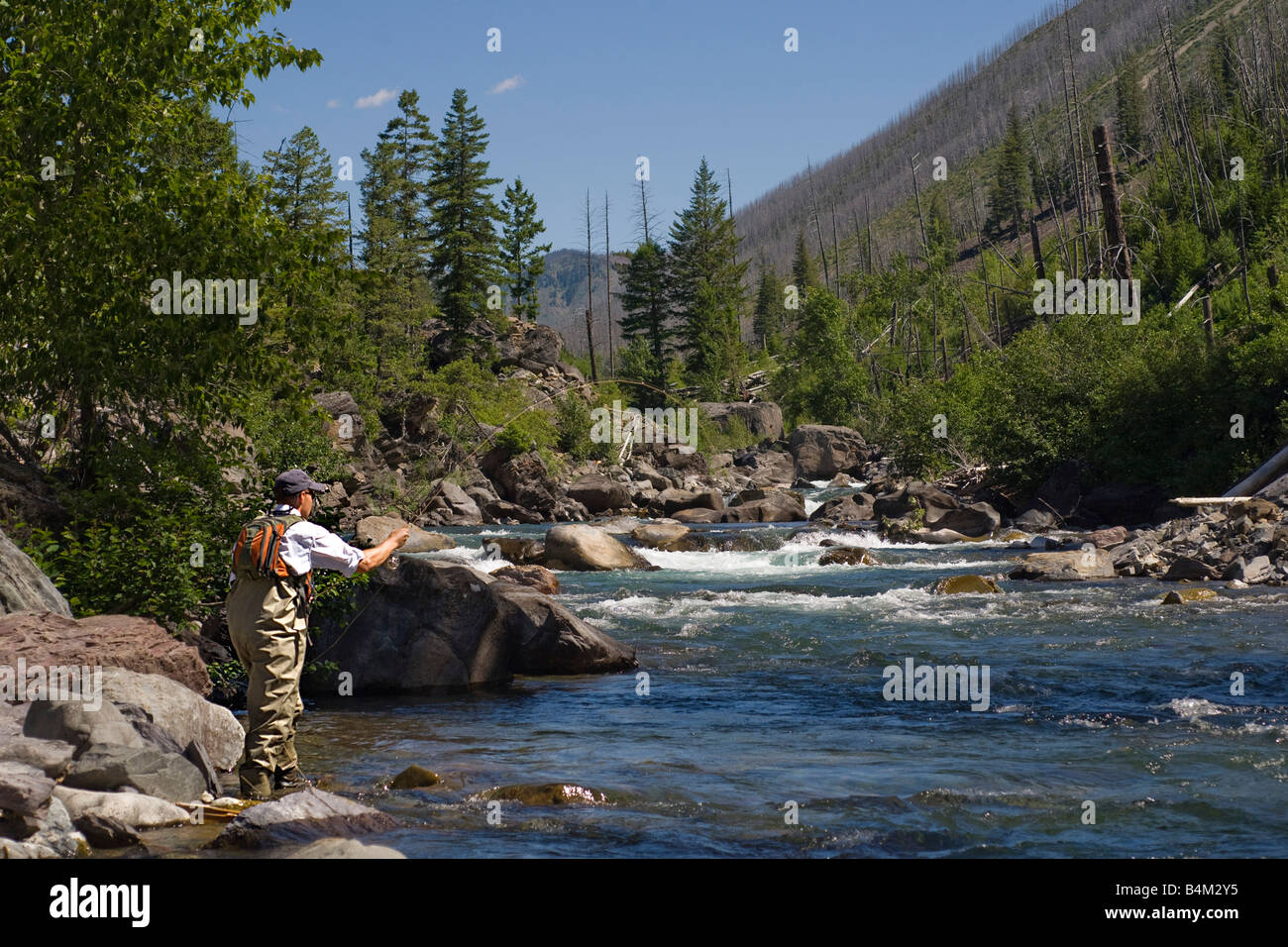 An angler fly fishing the North Fork of the Blackfoot River near