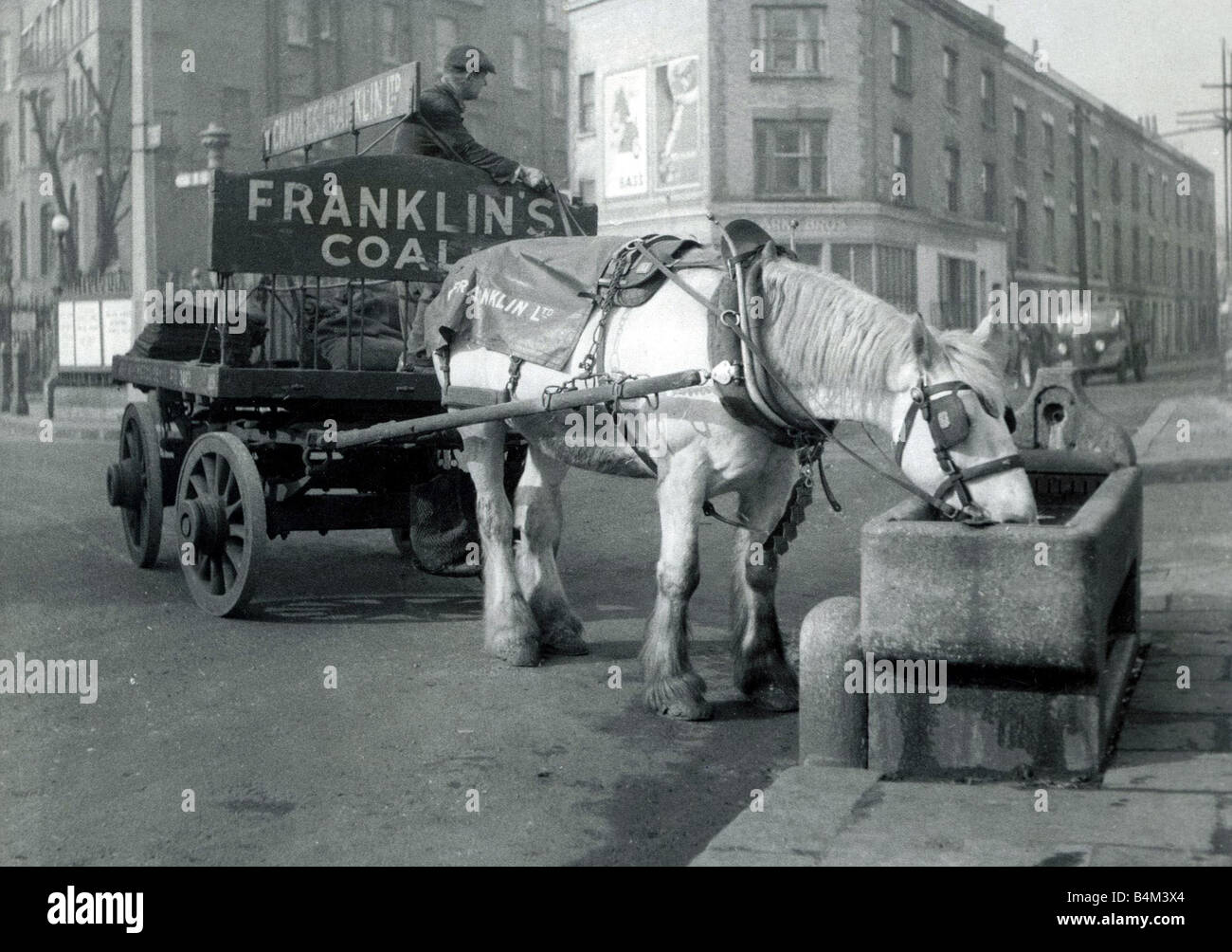 Horse and cart pulling coal through the streets of London Franklin s