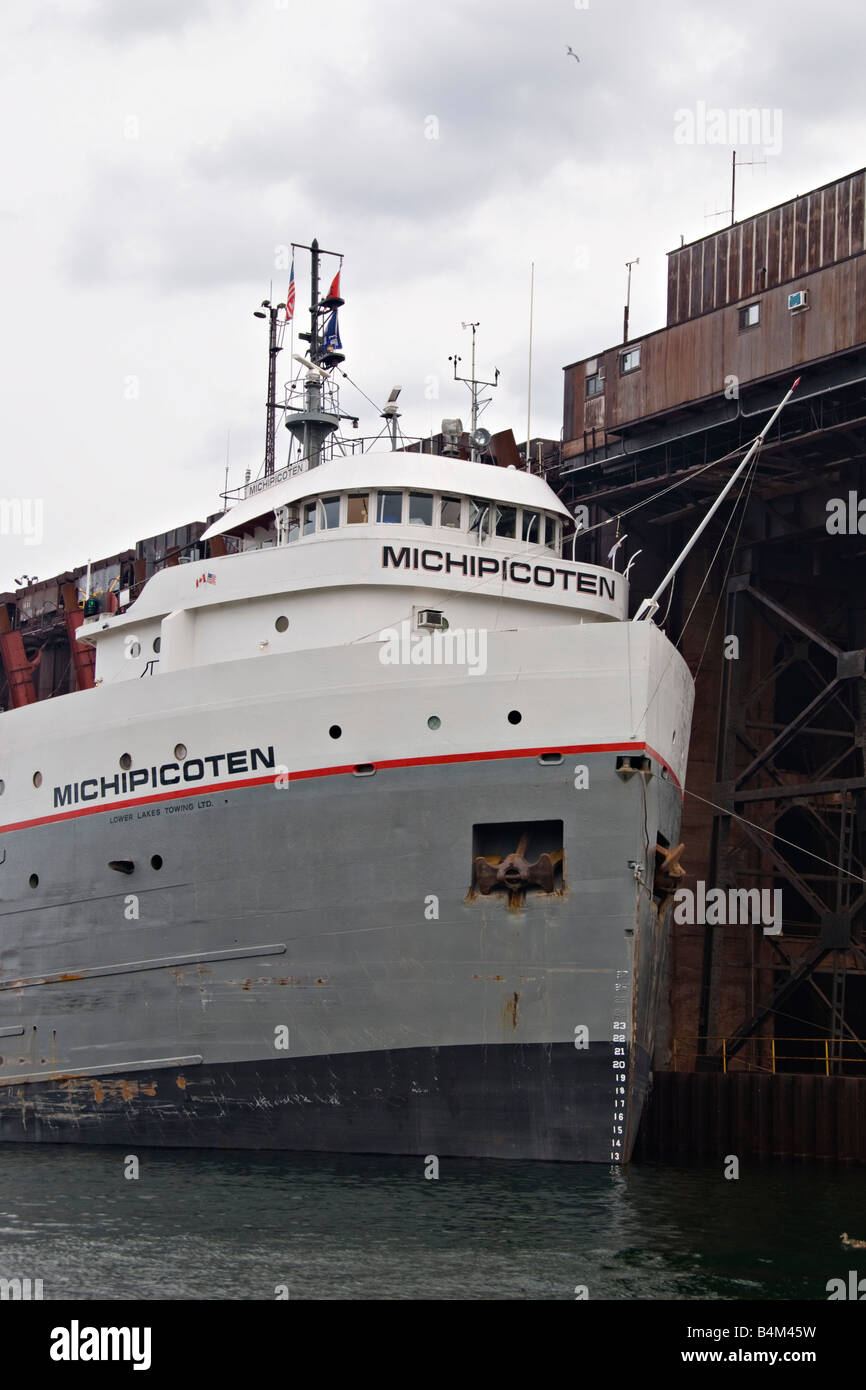 The Great Lakes freighter Michipicoten loads iron ore at the ore dock in Marquette Michigan Stock Photo
