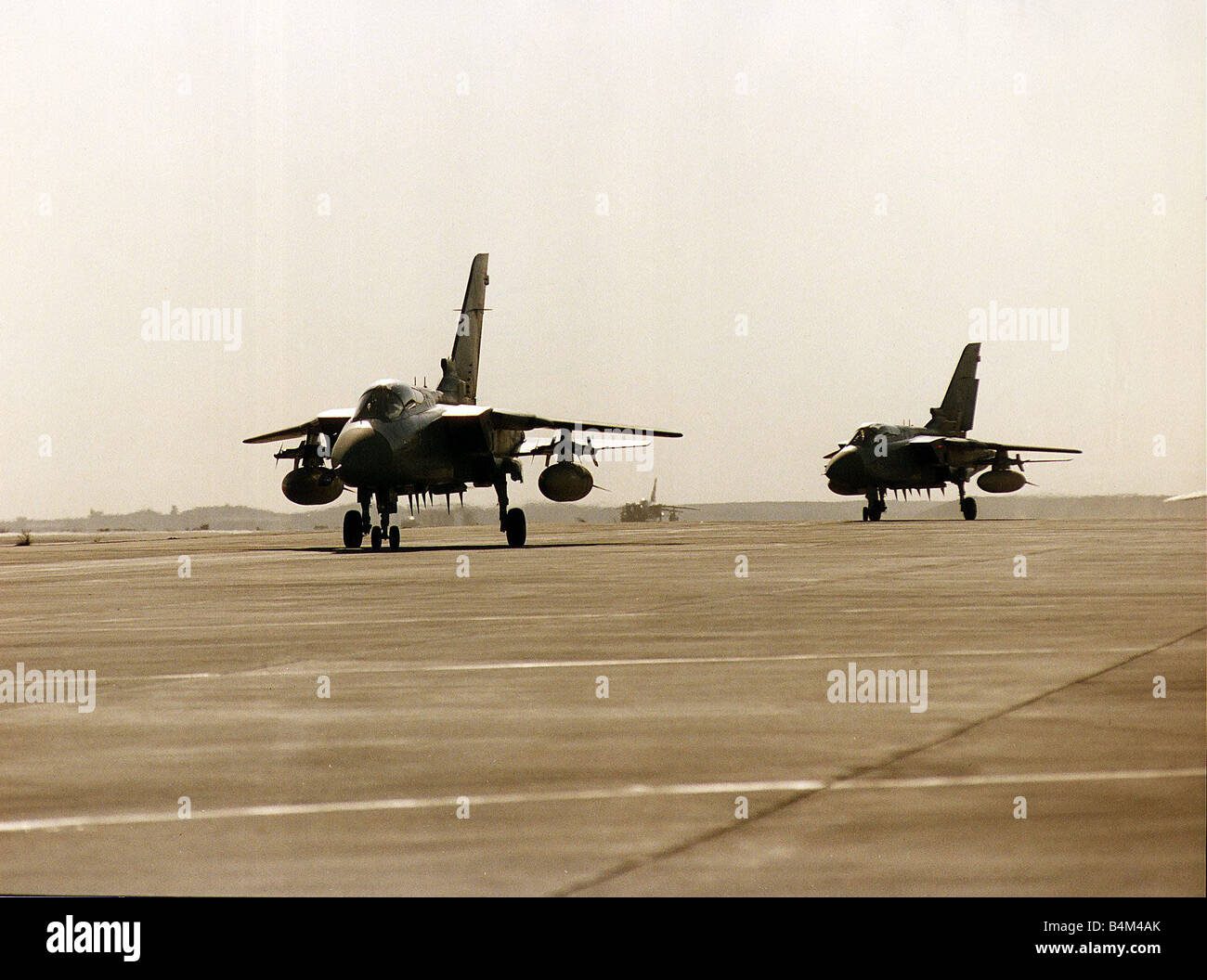 Two RAF Panavia Tornado F3 fighter planes used in the Gulf War taxi along runway Stock Photo