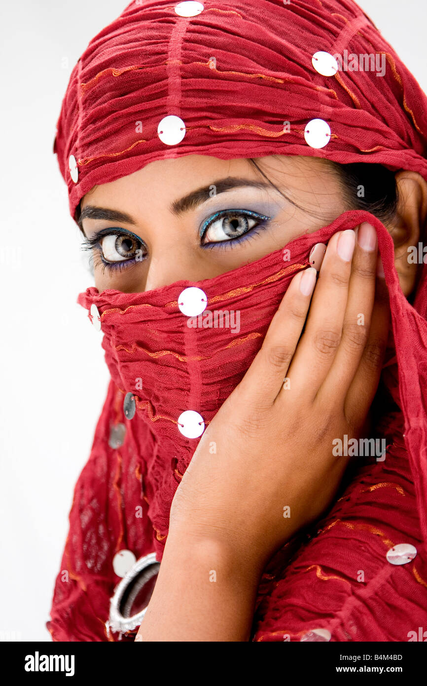 Beautiful woman with red head scarf isolated Stock Photo