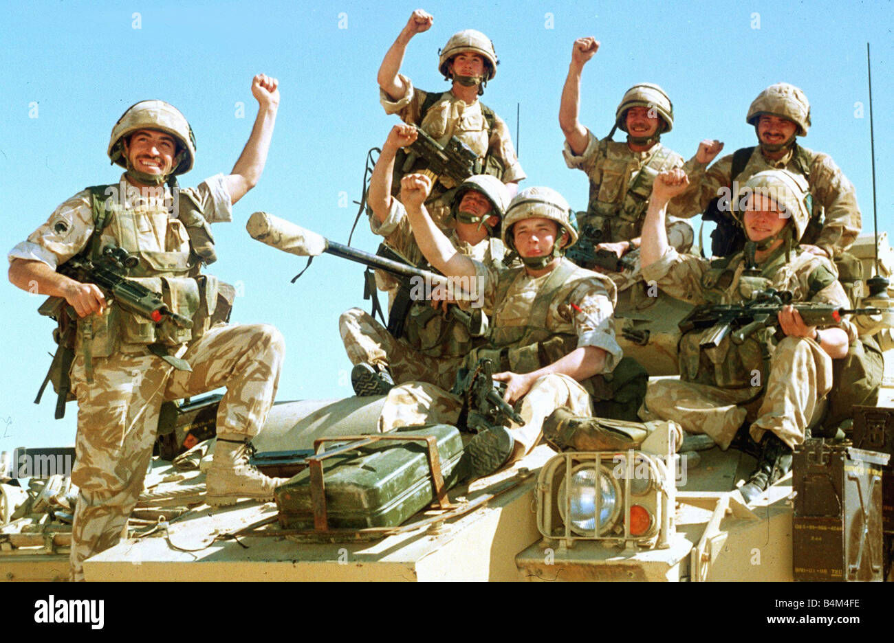 British infantrymen celebrate on a Warrior Armoured Personnel Carrier during the Gulf Crisis in January 1991 Stock Photo