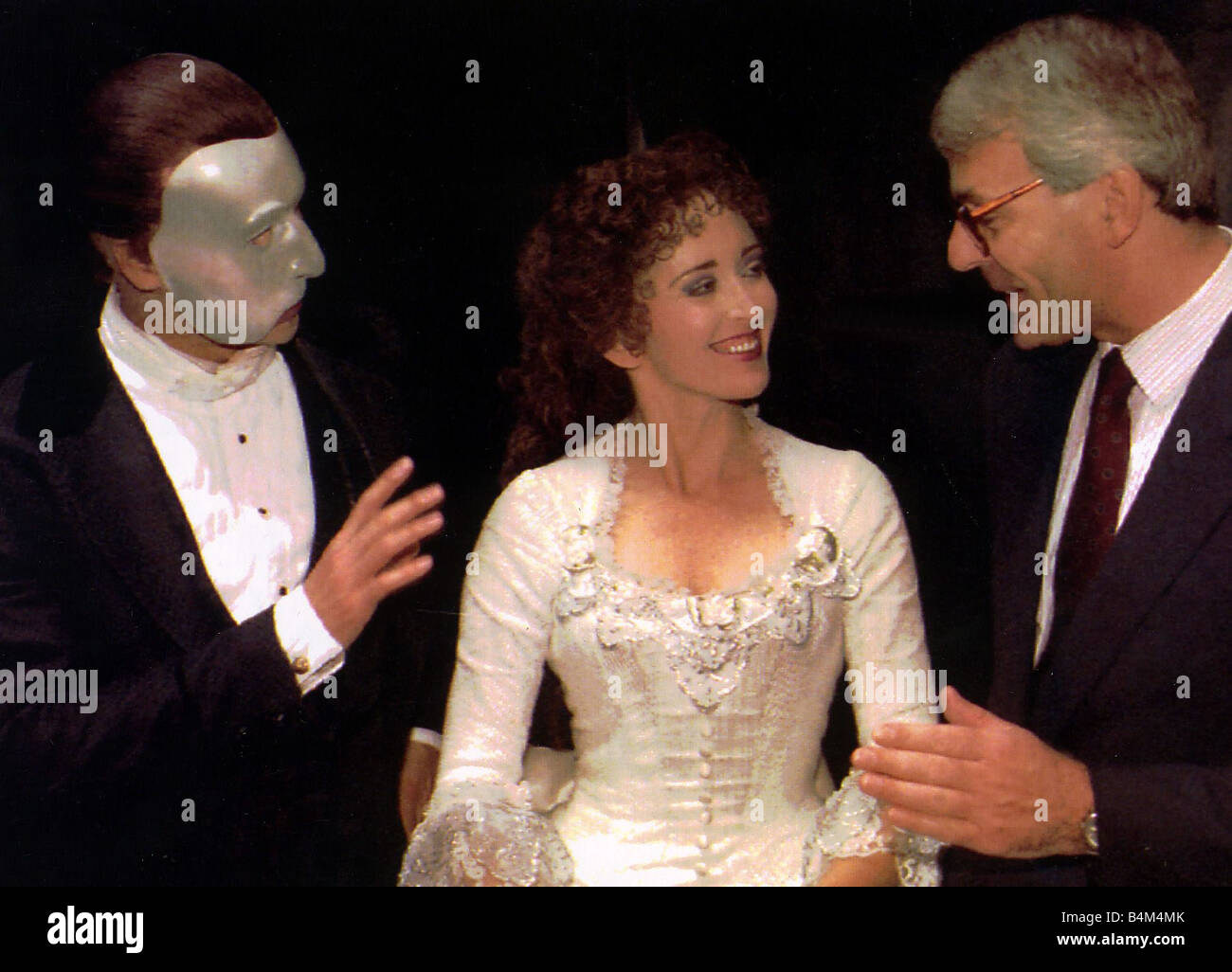 John Major at the musical Phantom of the Opera with Kevin Gray gesturing and Teri Bibb looking on 1991 Stock Photo