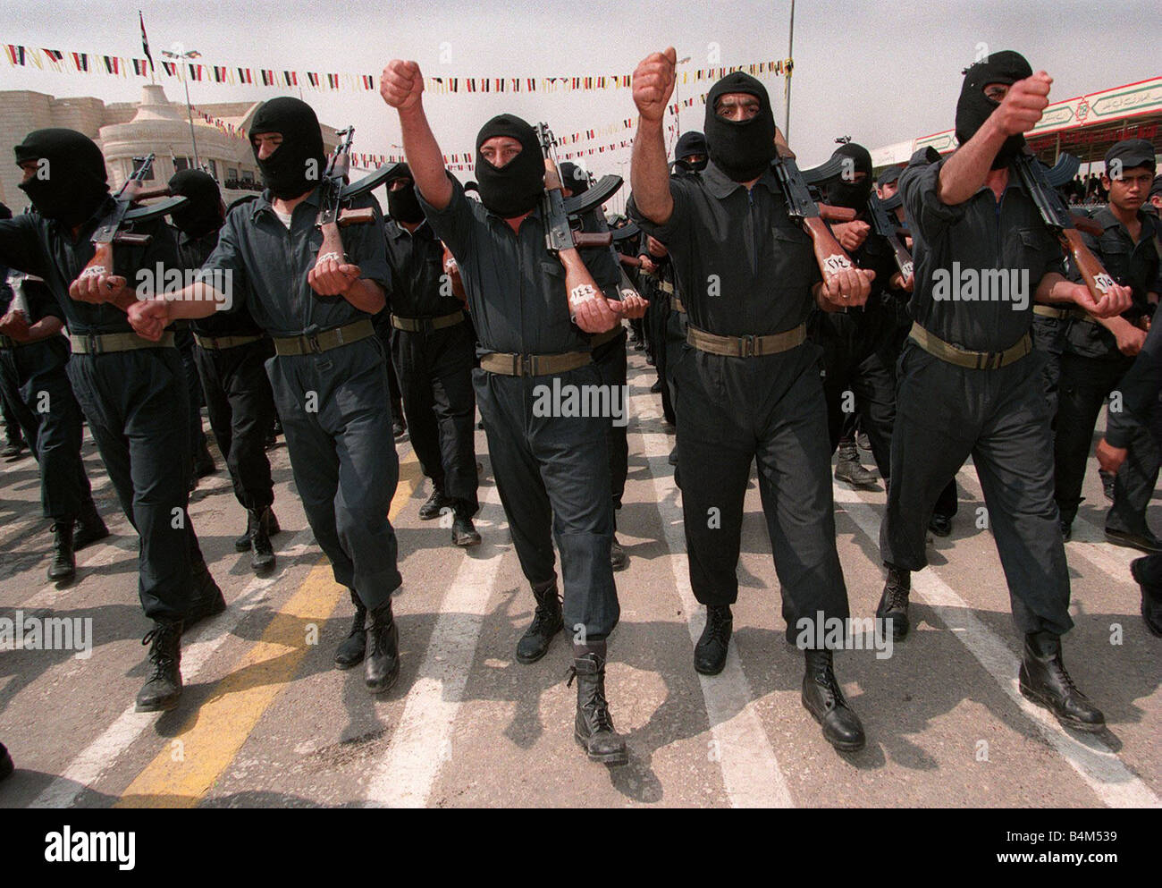 Volunteer Reserve Army May 1998 Parade in Tikrit the birthplace of Saddam Hussein Our Picture Shows Men of the Suicide Commandos wearing in black masks Stock Photo