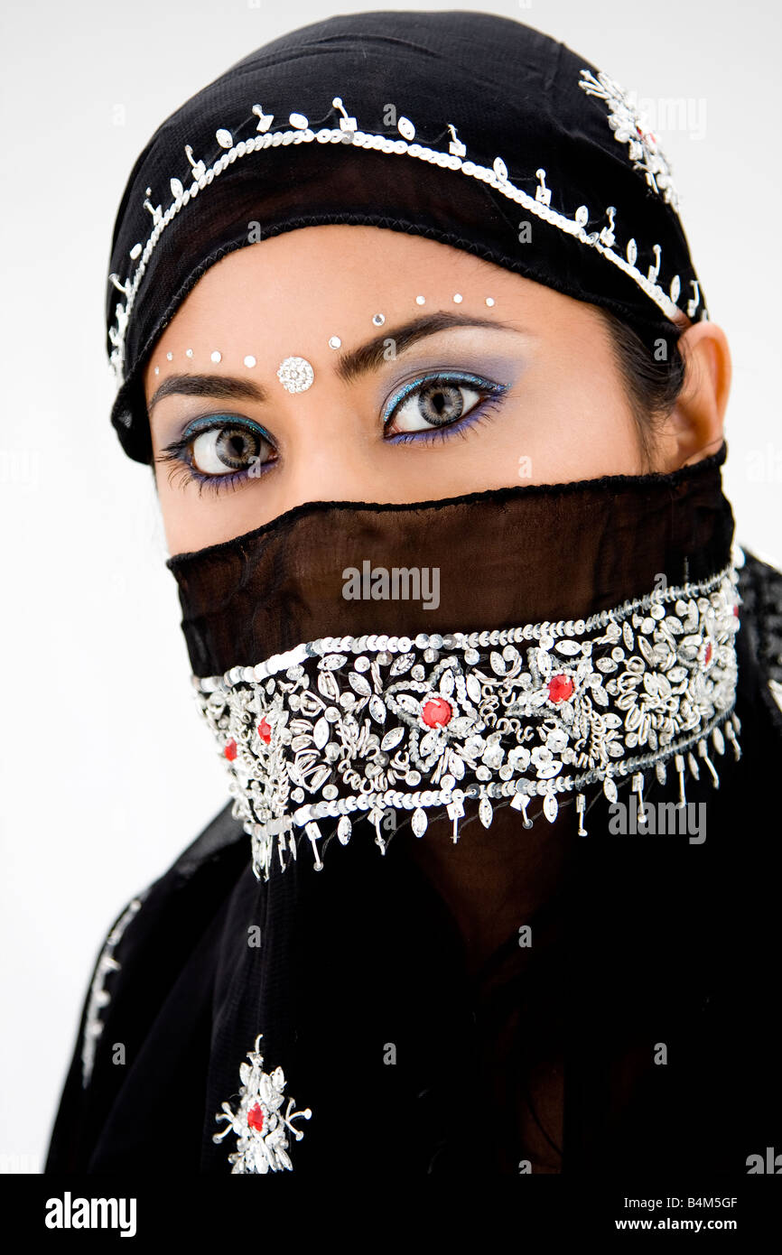 Beautiful gypsy woman with black head scarf isolated Stock Photo
