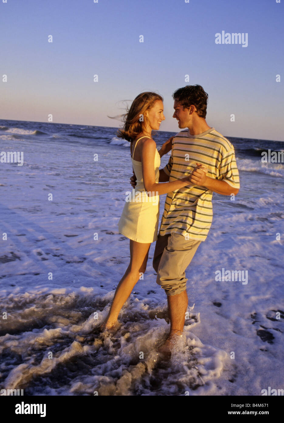 Happy man dancing on beach hi-res stock photography and images - Alamy
