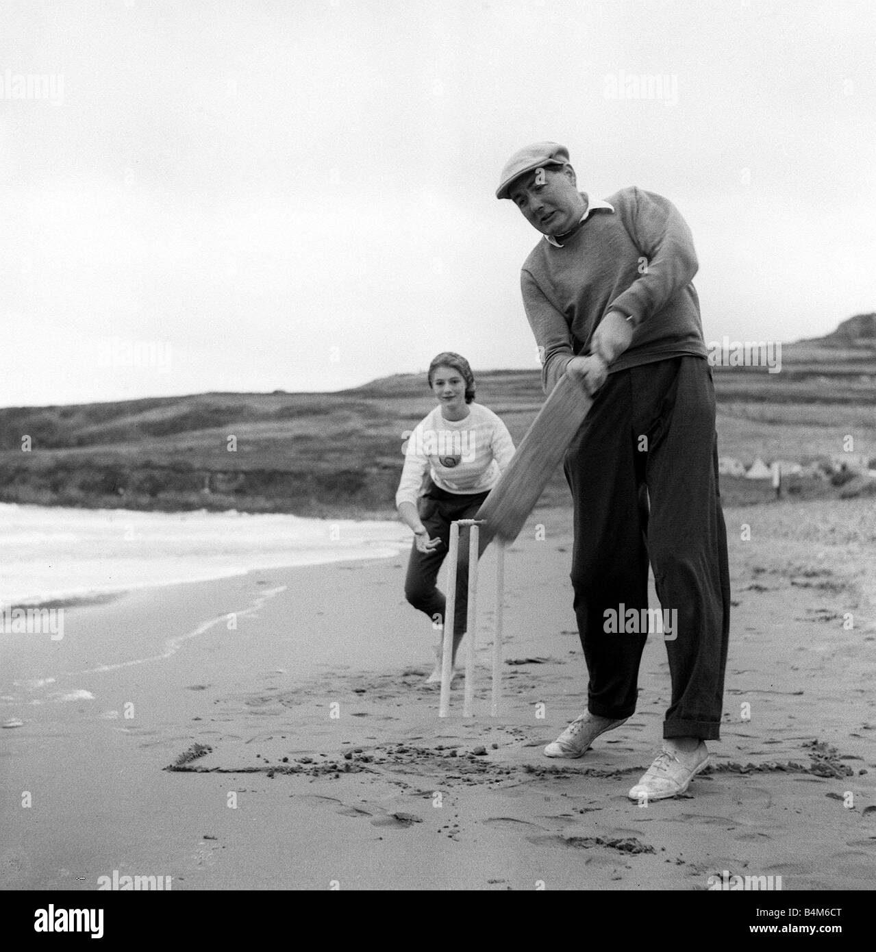 James Callaghan MP on Holiday AugUST 1957 in St Davids Pembrokeshire with family and dog Margaret Callaghan Baroness Jay keeps wicket during a game of Cricket Stock Photo