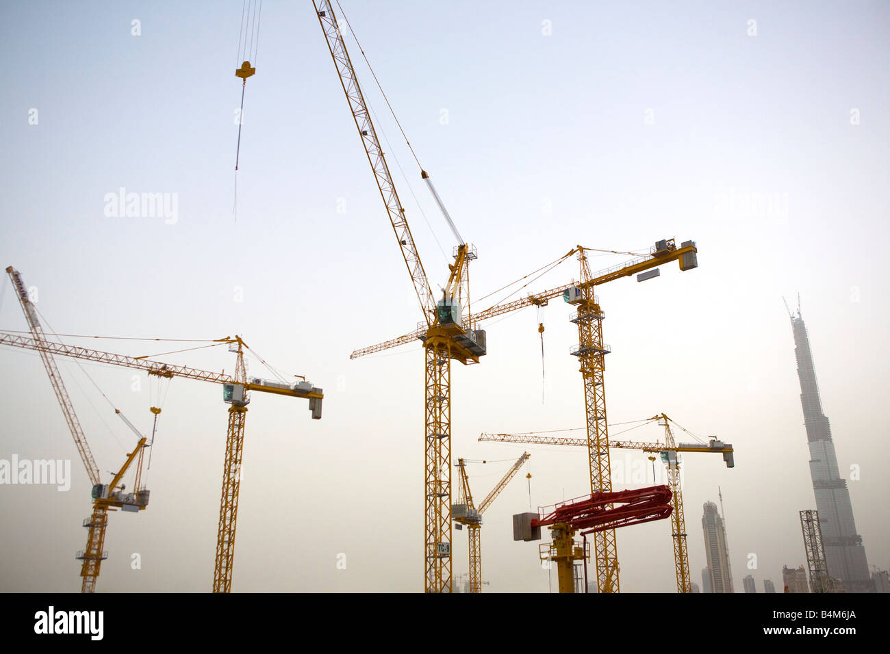 United Arab Emirates, Dubai, Sheikh Zayed Road. Cranes and the Burj Dubai. Stock Photo