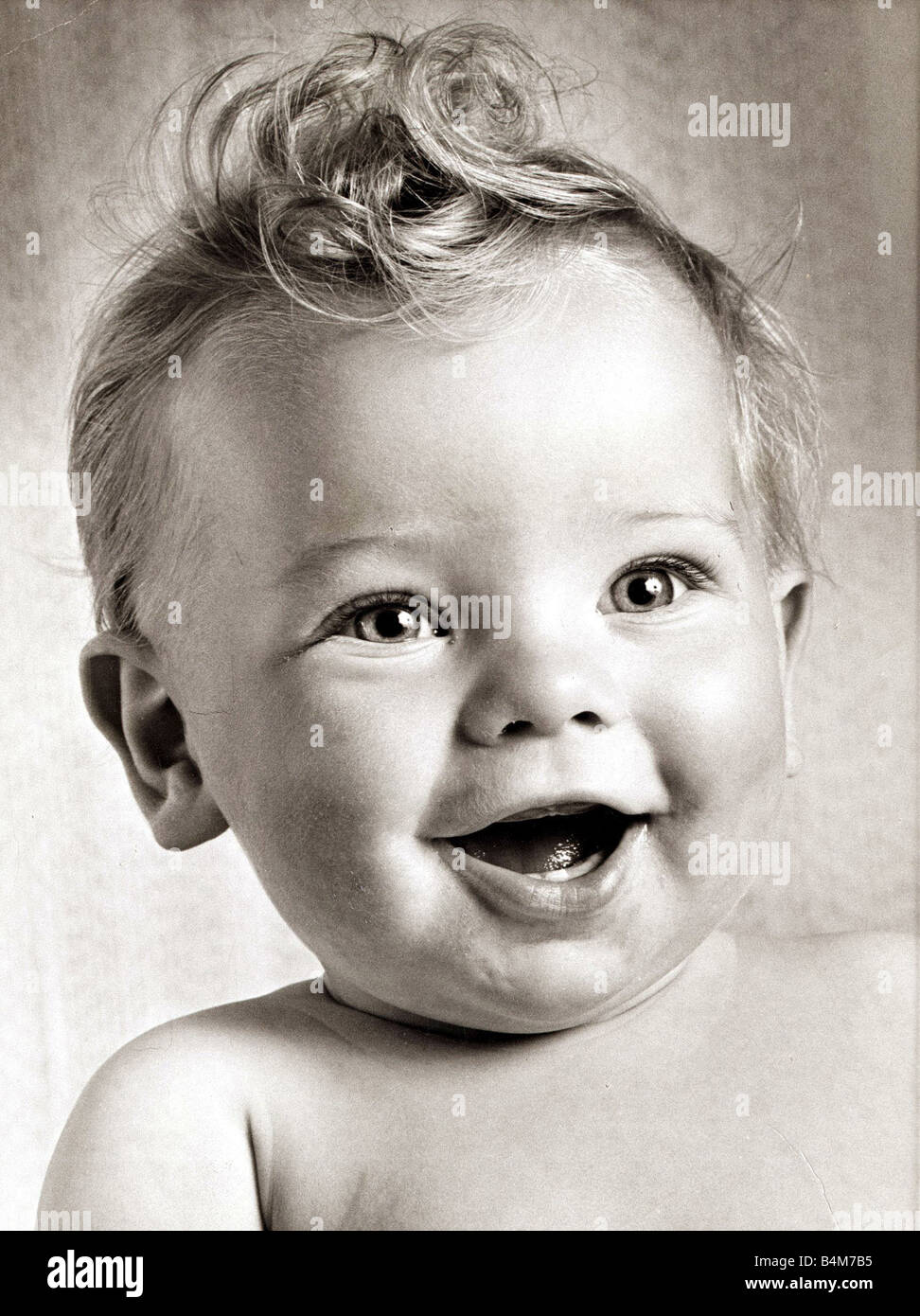 Happy baby boy with a stylish haircut, Circa 1950 Stock Photo