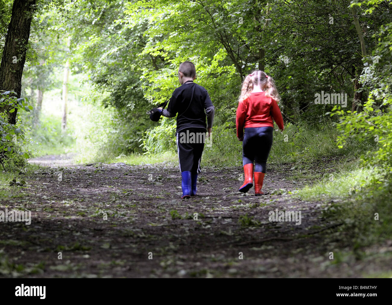 A brother and sister playing in the woods Stock Photo - Alamy