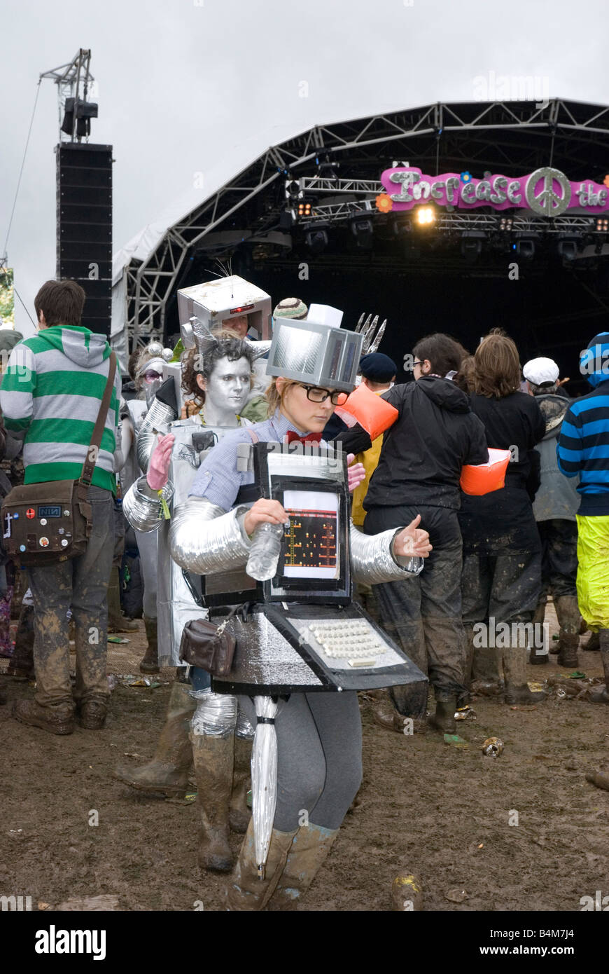 Group of people dressed up as a computer machine, walking in a mud, Bestival , Isle of wight UK 2008 Stock Photo