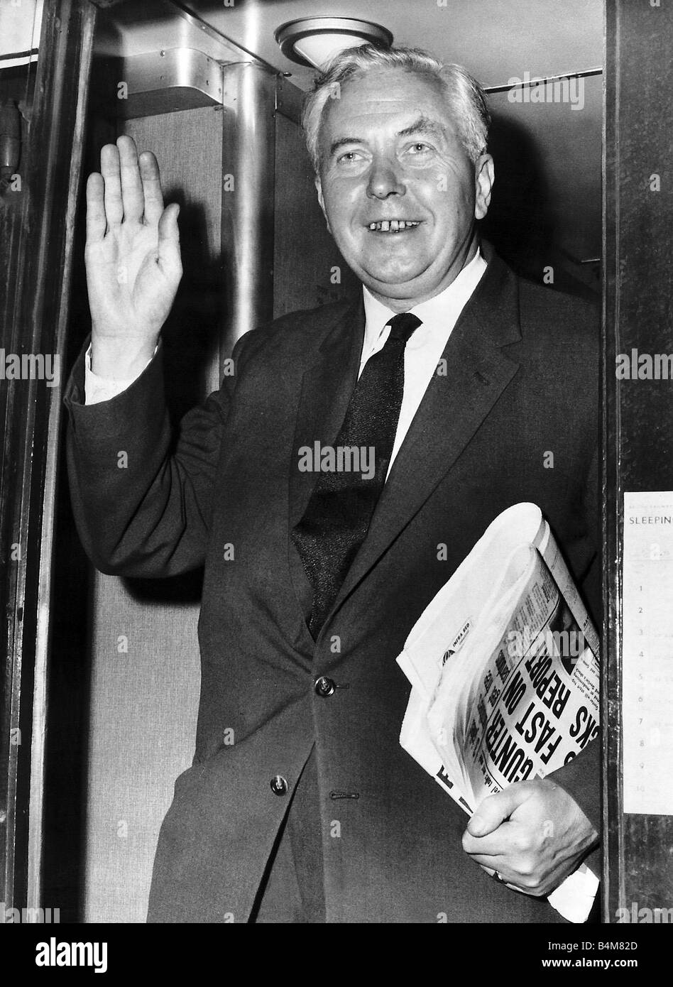 harold-wilson-prime-minister-waving-and-holding-a-newspaper-under-B4M82D.jpg