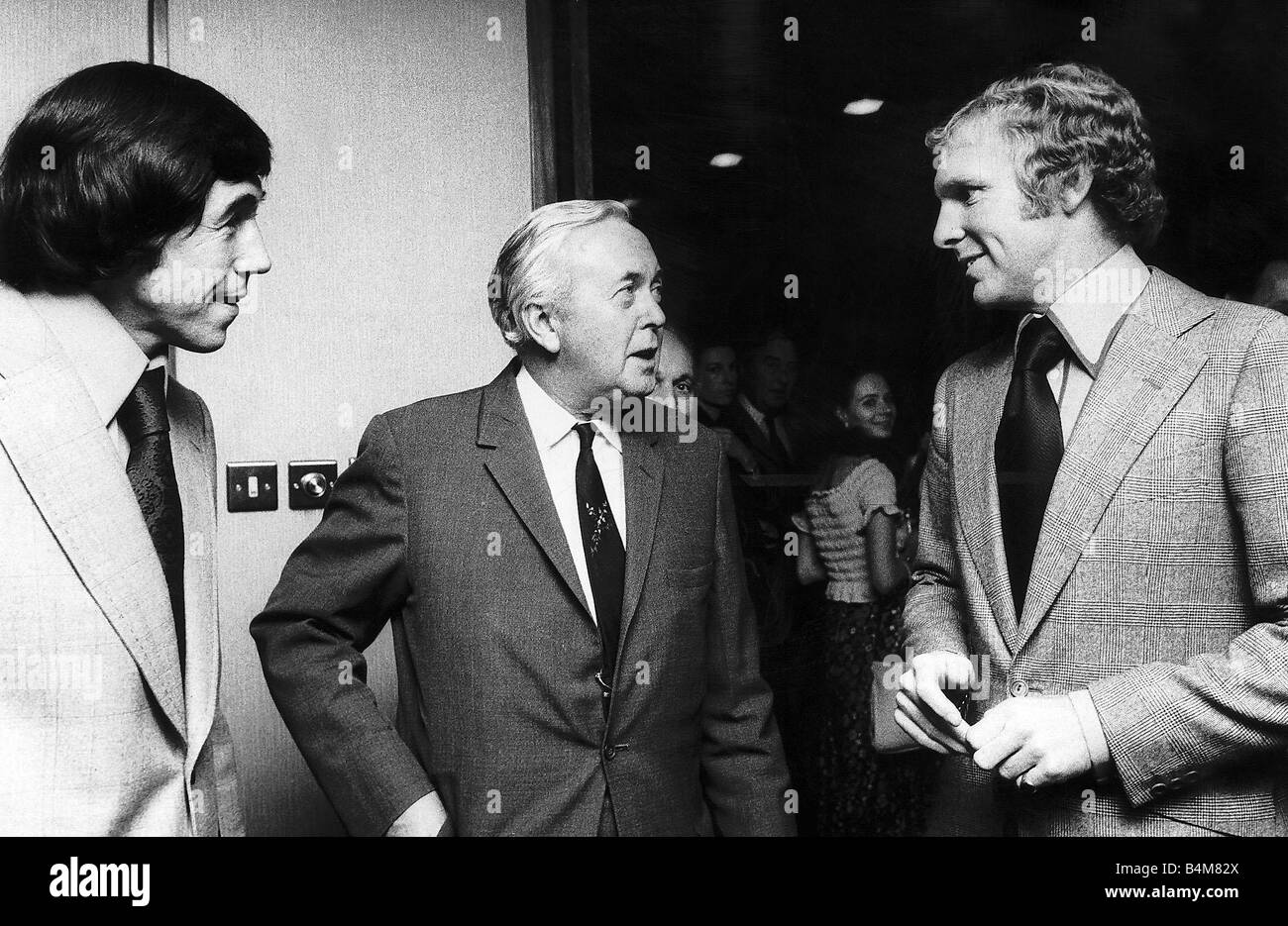 Harold Wilson Labour Prime Minister of Britain chats to Bobby Moore former captain of England football and Gordon Banks former England goalkeeper at an evening held in their honour at the Sportsman Club Tottenham Court Road Stock Photo