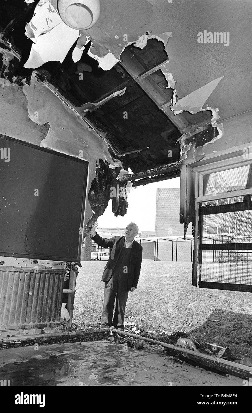 Arson Attack At Boys Model School Belfast July 1980 Mr Stewart Miller caretaker at the Boys Model School surveys the damaged classroom The Belfast Education Board faces a hefty bill after the worst attack on schools in recent years by arsonists Stock Photo