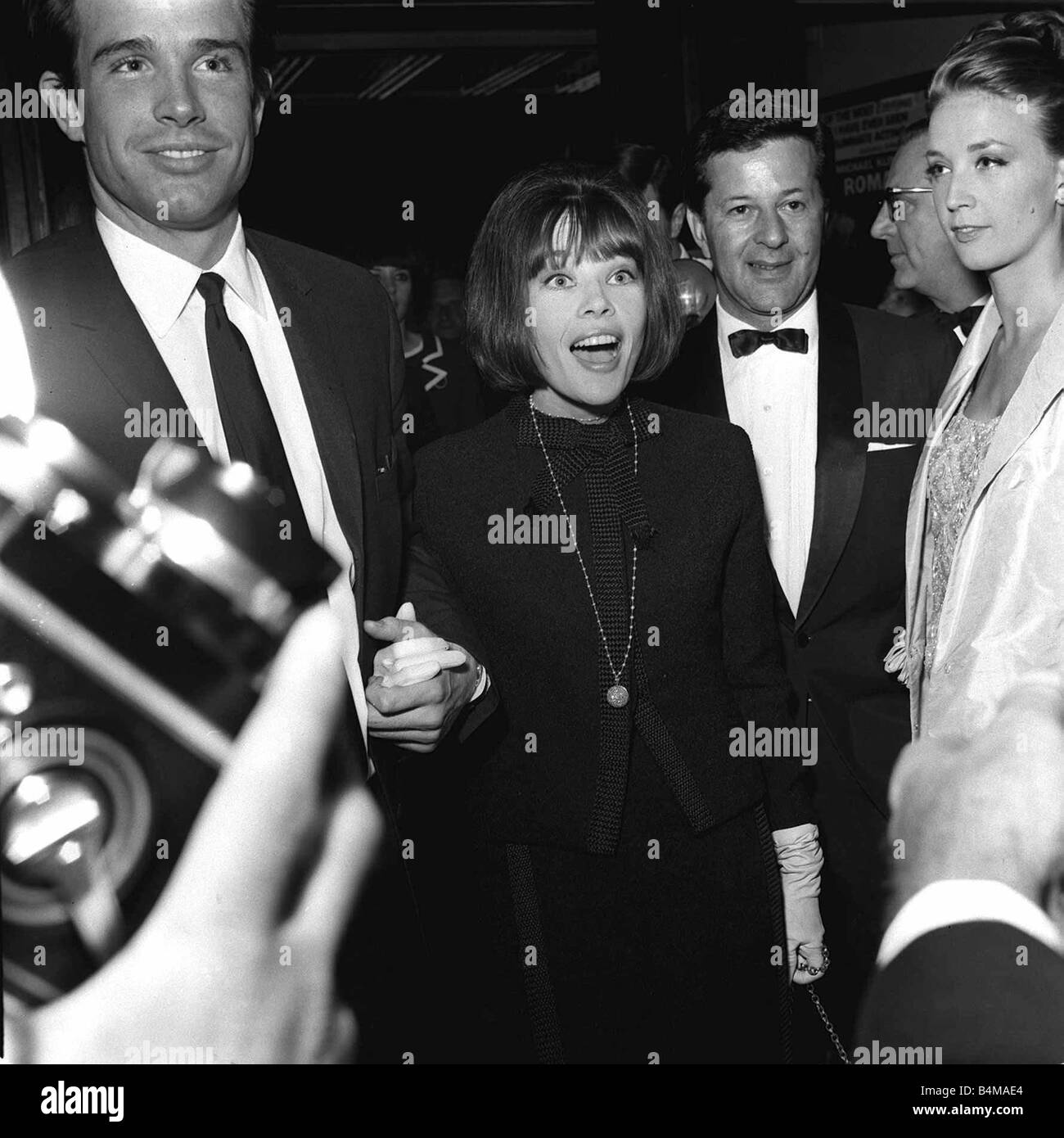 Warren Beatty actor and actress Leslie Caron June 1965 arrive for the premiere of the film Repulsion Stock Photo