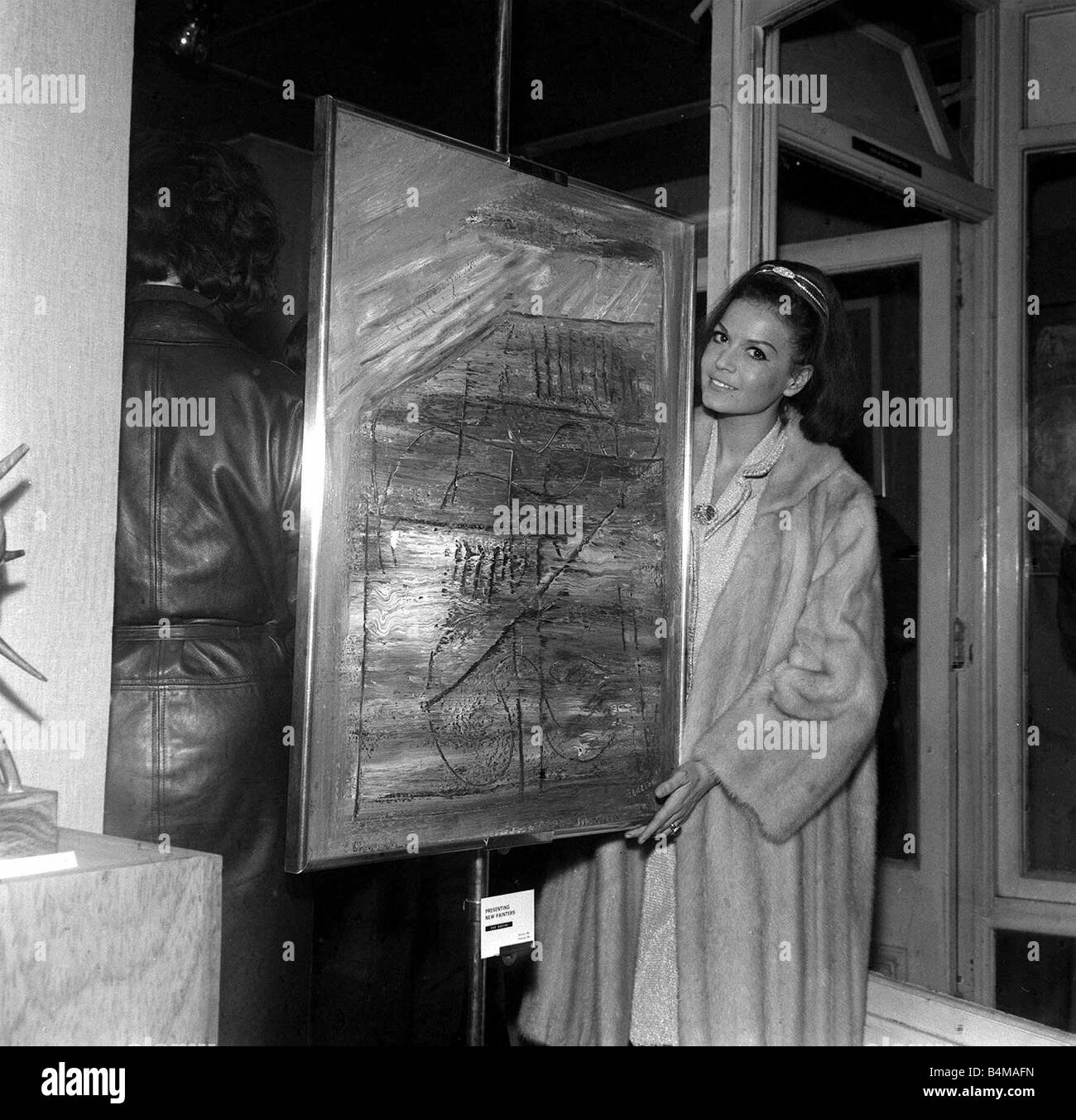 Eva Bartok actress January 1964 with one of her abstract paintings Stock Photo