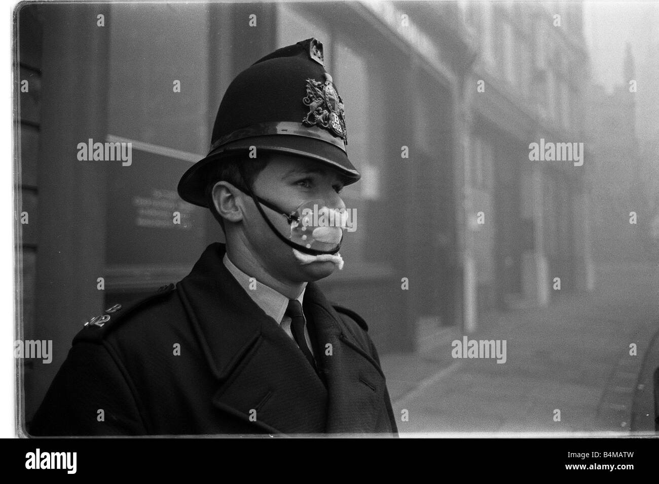 Policeman in smog mask December 1962 PC John Finn from Snow Hill Police Station in the London smog of 1962 He is wear a mask to Stock Photo