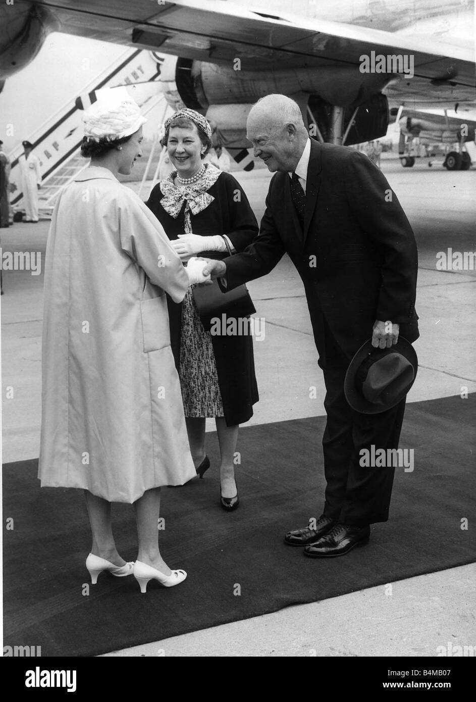 Queen Elizabeth welcomes President Eisenhower and his wife when they arrived by air form Wasington at the Royal Canadian Air Force base at St Hubert near Montreal June 1959 Stock Photo