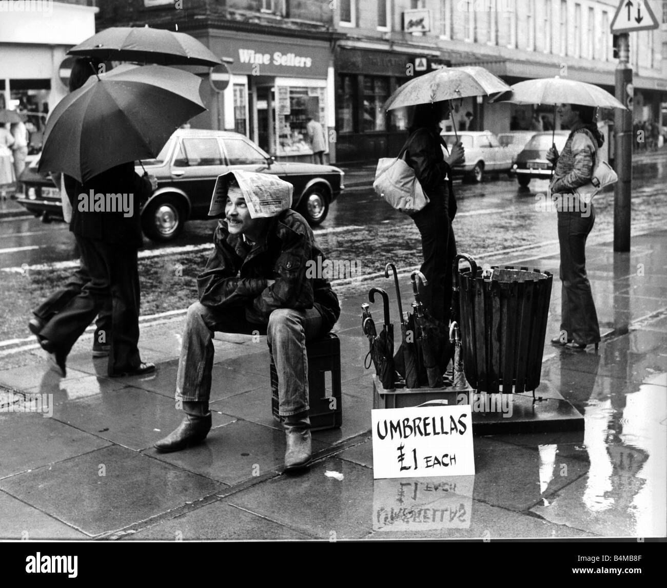 Funny fella and thats how the Raindrops keep falling on my newspaper salesman did business in London This salesman did not want Stock Photo