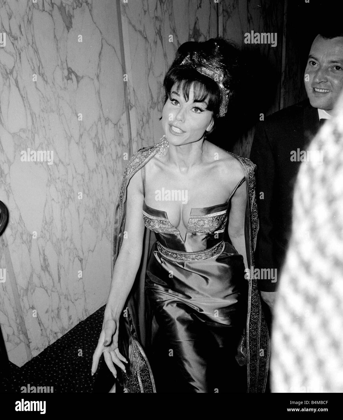 The VIPs Film Premiere September 1963 Laya Raki Actress Singer pictured arriving at the Empire Theatre Leicester Square waves waving smiling Stock Photo